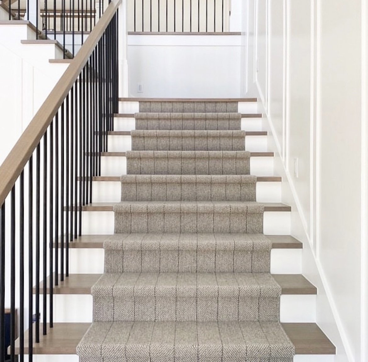 Stairs with runner and metal spindles in Burlington Ontario