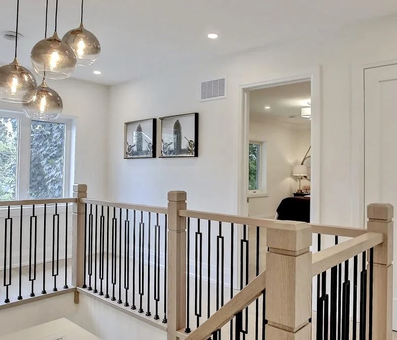 Landing with metal and wooden railings in Burlington Ontario