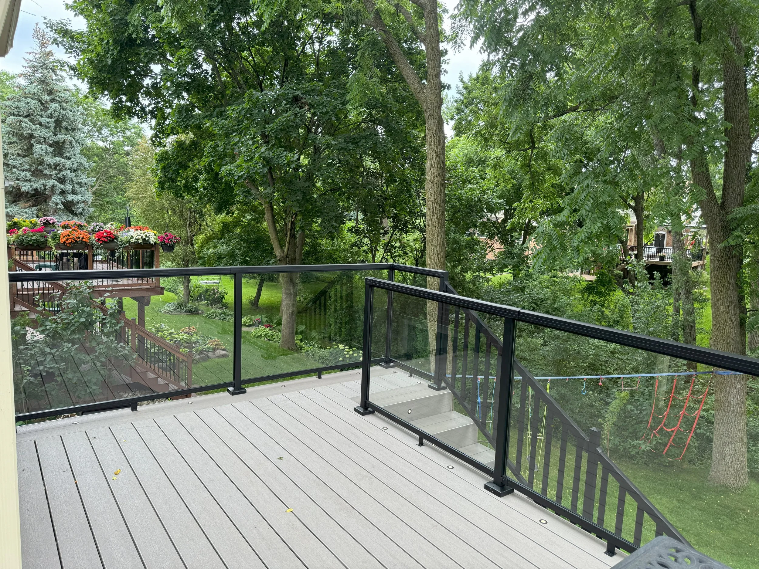 multi-level composite deck in Burlington Ontario with glass railings
