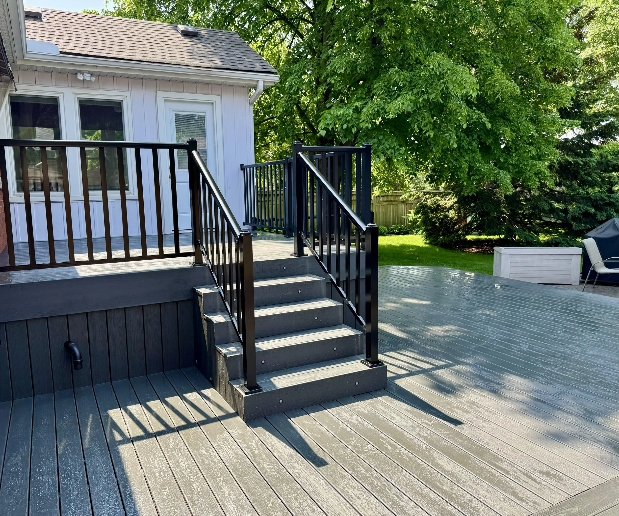 multi-level composite deck with metal railings in Burlington Ontario
