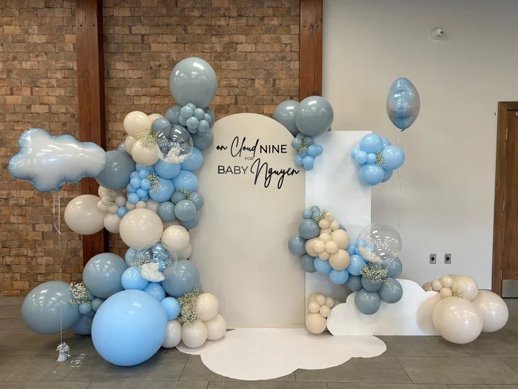 Two-panel backdrop with dusty blue and cream balloon garland