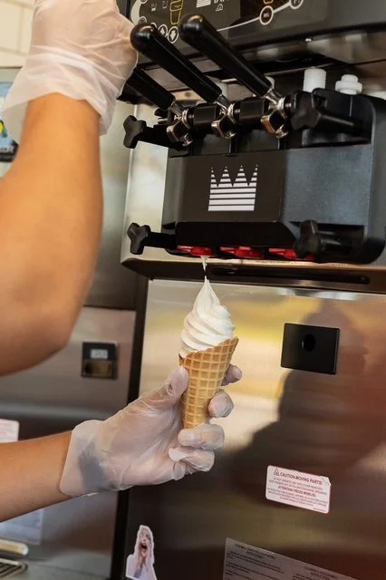 Soft serve ice cream cone and ice cream machine