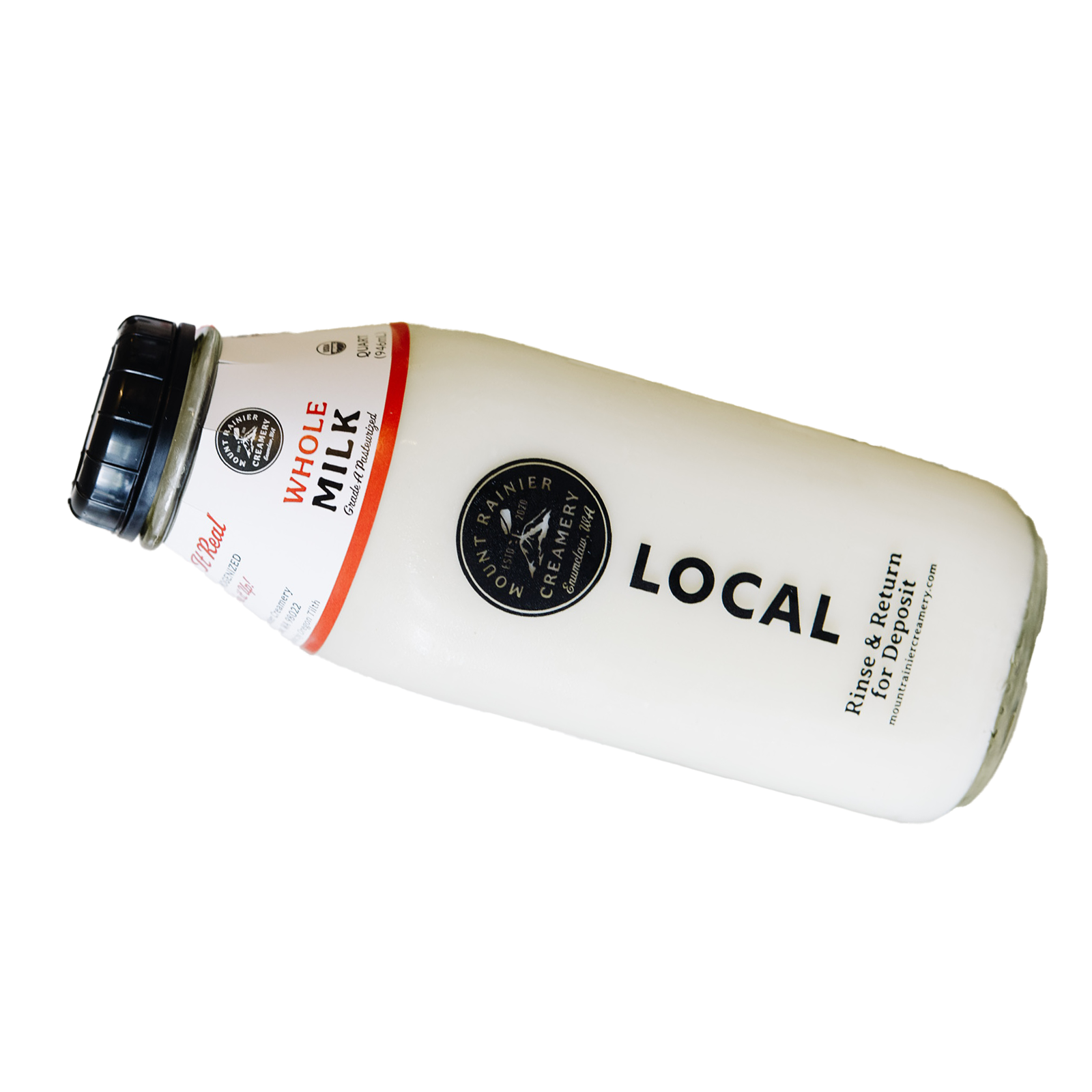 Fresh local whole milk in a glass bottle