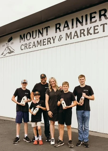 the Mensonides Family in front of the market