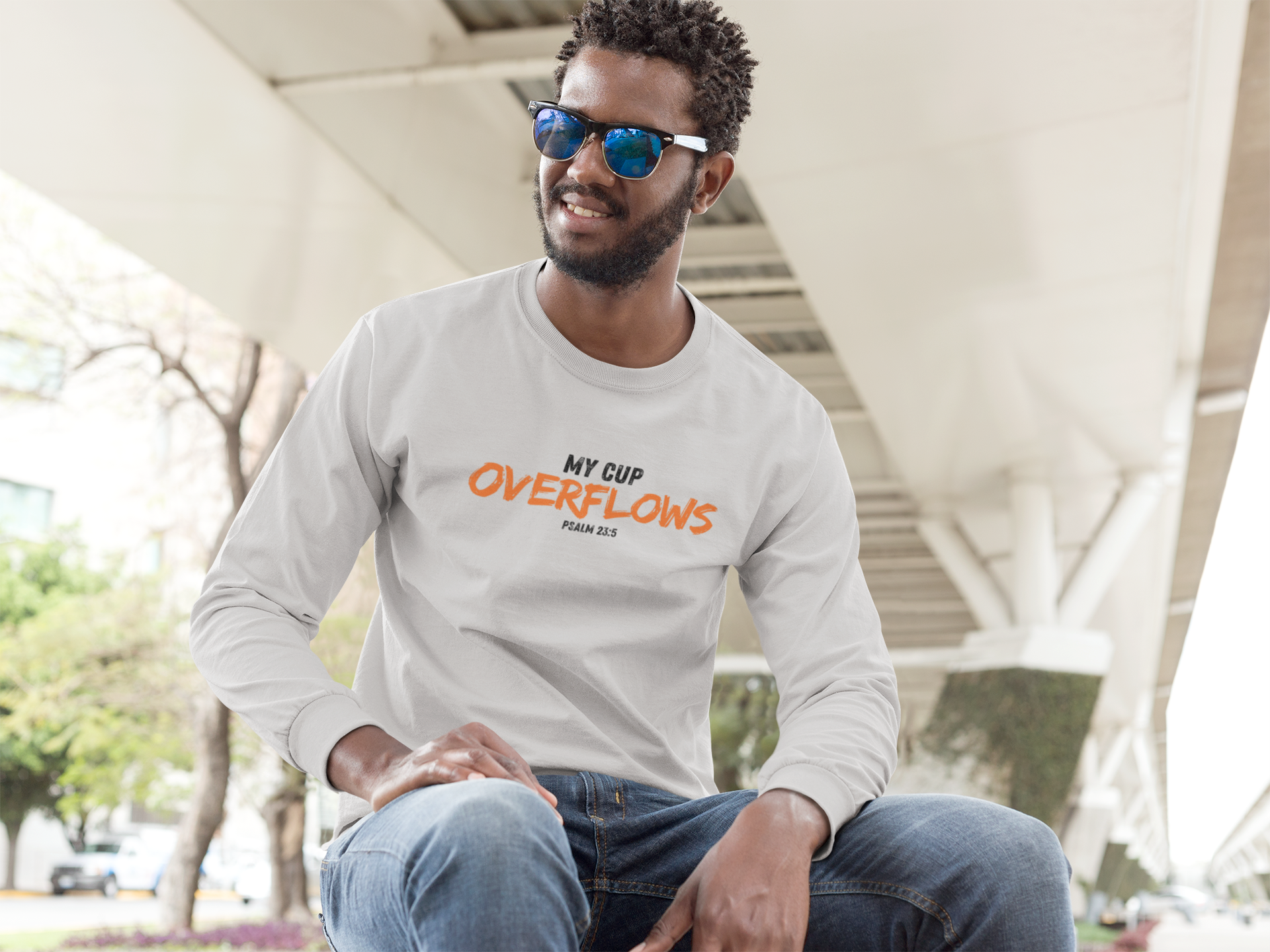 long-sleeve-t-shirt-mockup-of-a-man-sitting-on-a-bench-a9450.png