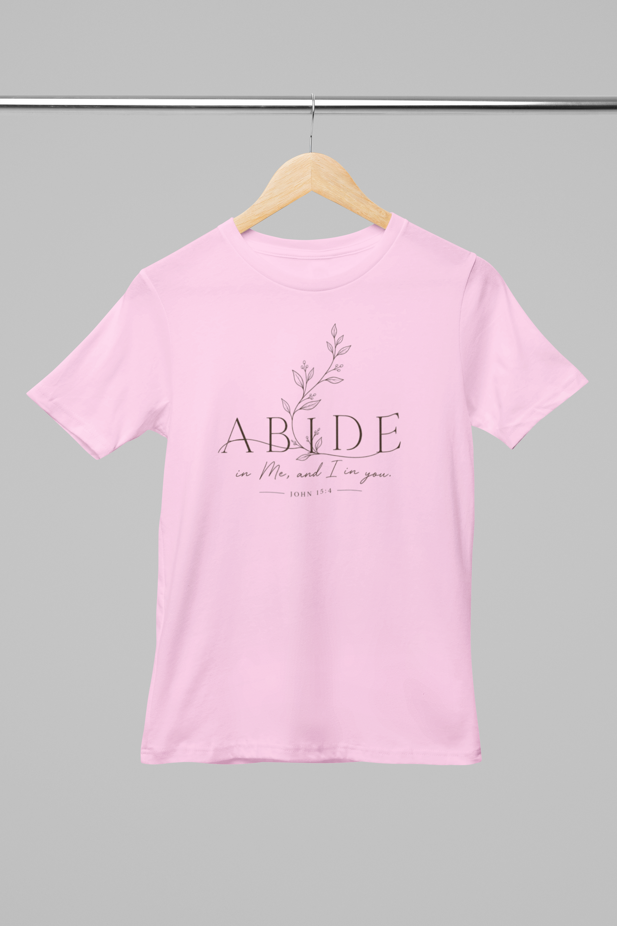 mockup-of-a-round-neck-bella-canvas-t-shirt-placed-on-a-hanger-m33392 (1).png