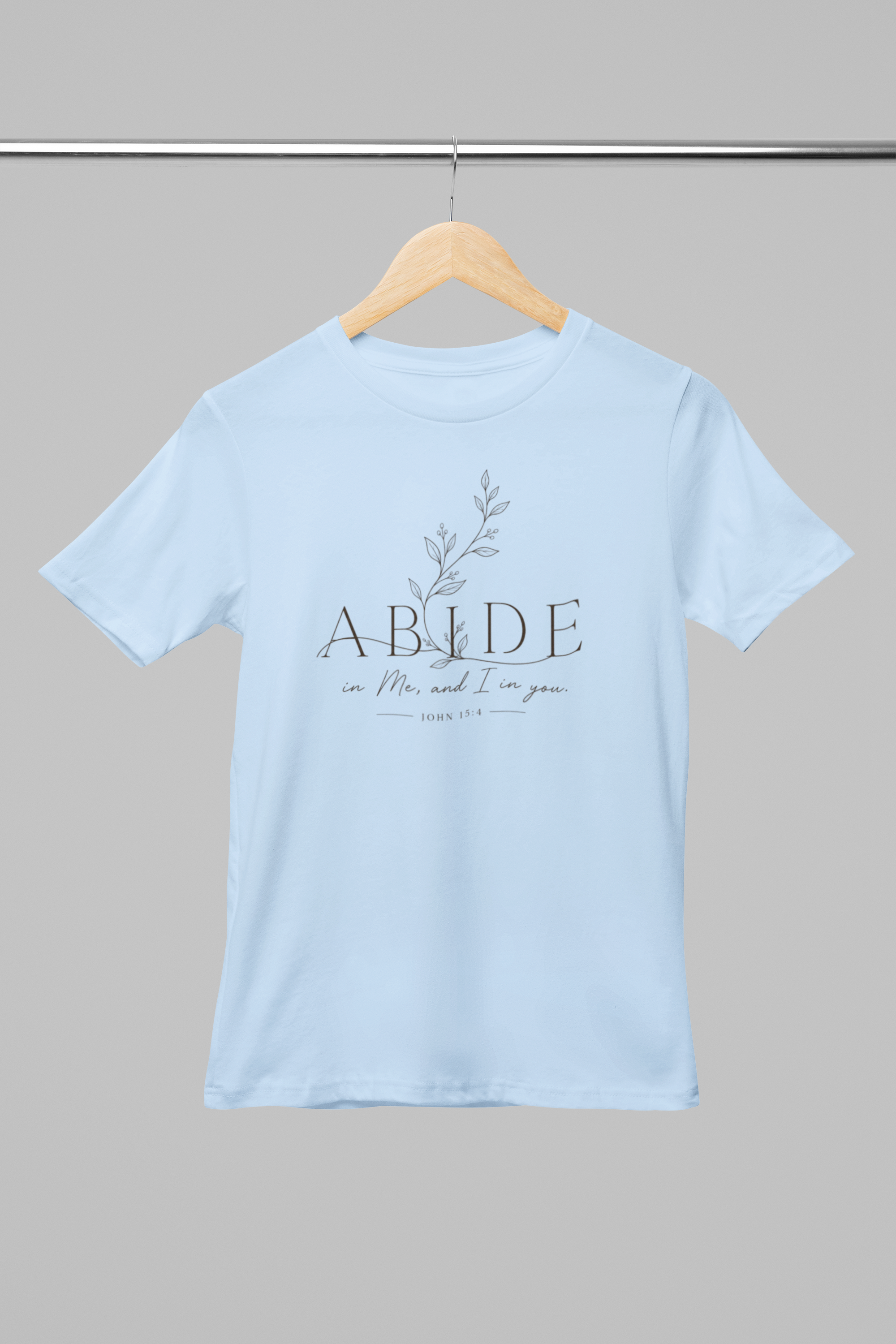 mockup-of-a-round-neck-bella-canvas-t-shirt-placed-on-a-hanger-m33392 (3).png