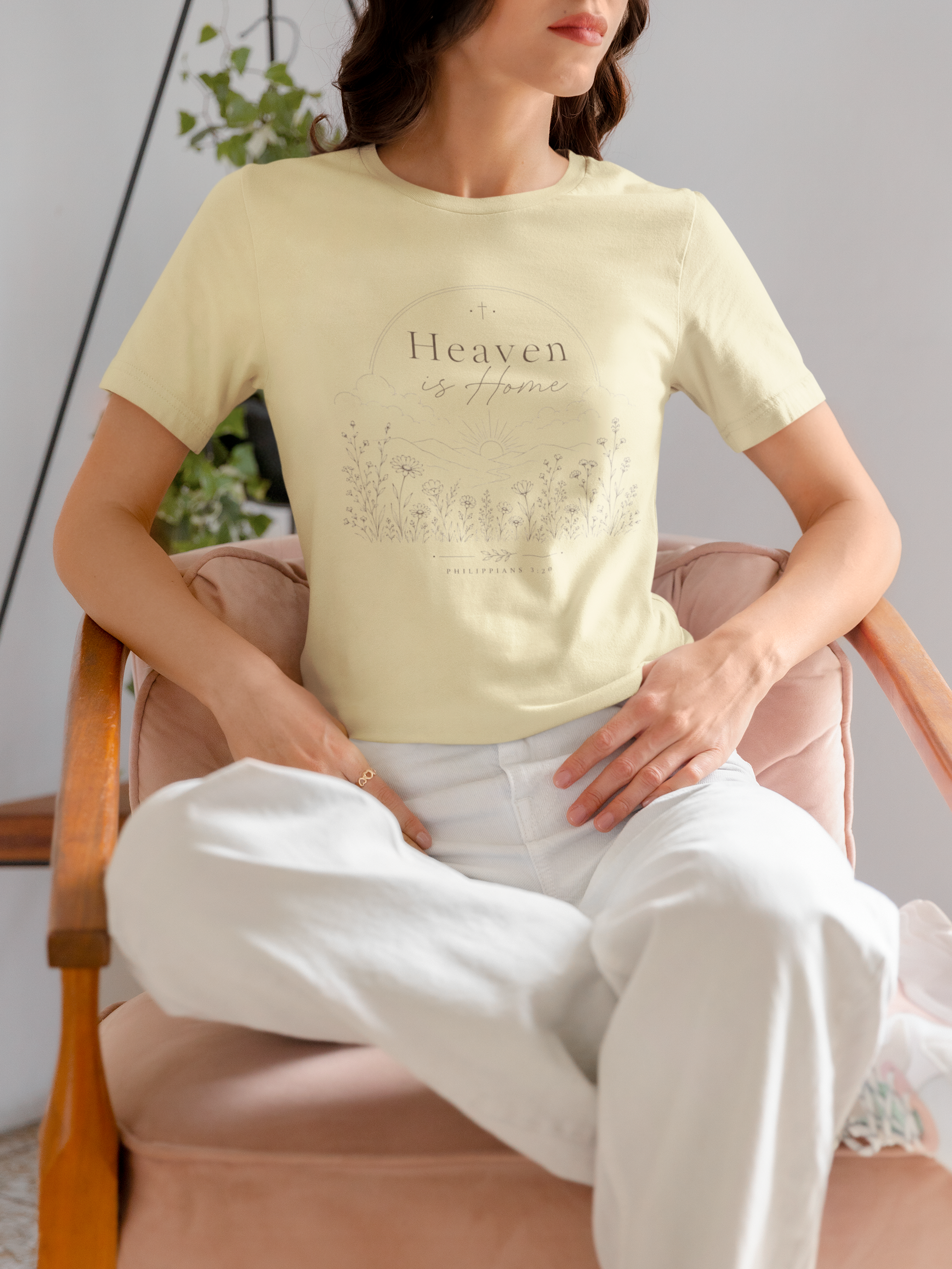 mockup-of-a-woman-wearing-a-bella-canvas-t-shirt-on-a-chair-m37309.png