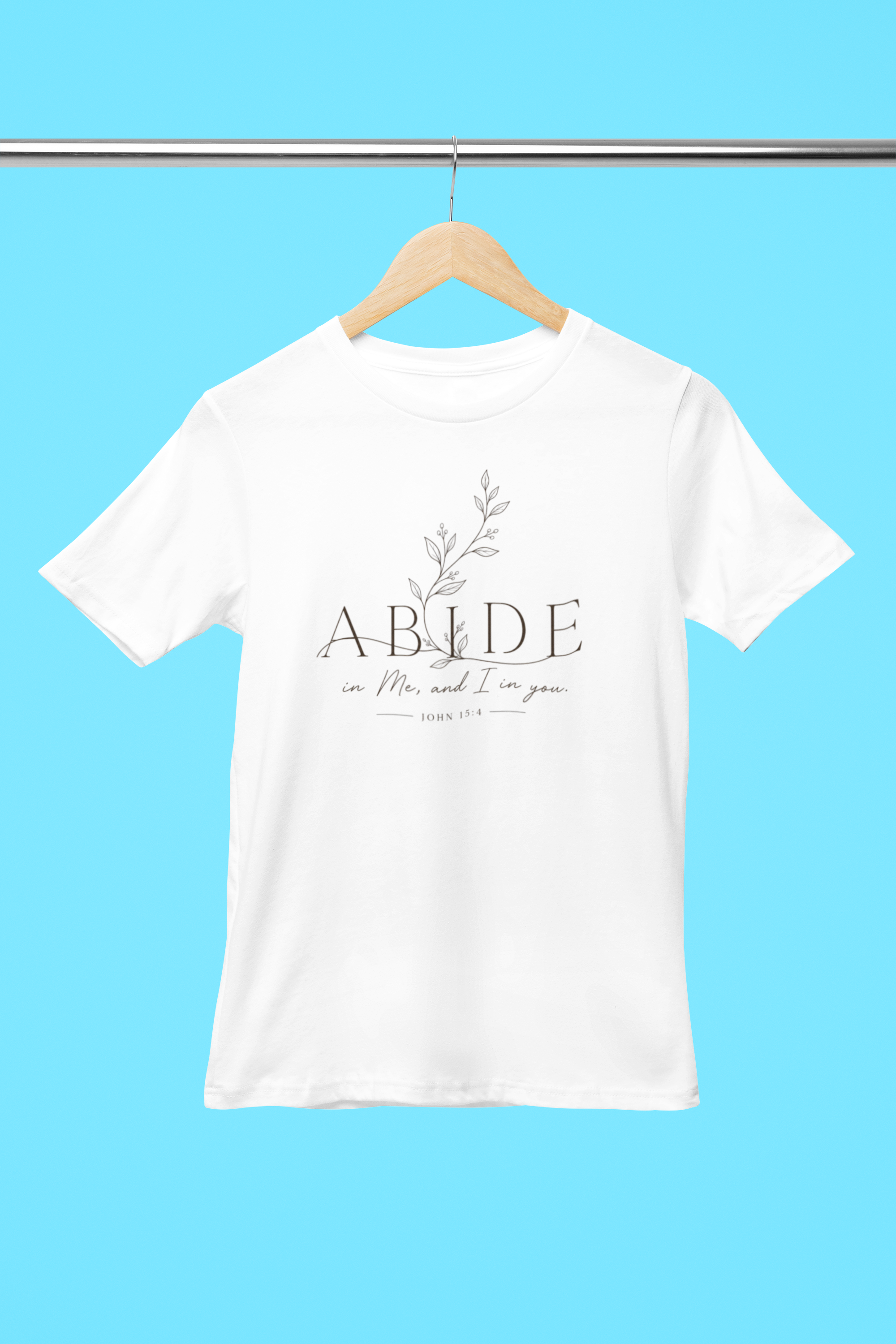 mockup-of-a-round-neck-bella-canvas-t-shirt-placed-on-a-hanger-m33392.png