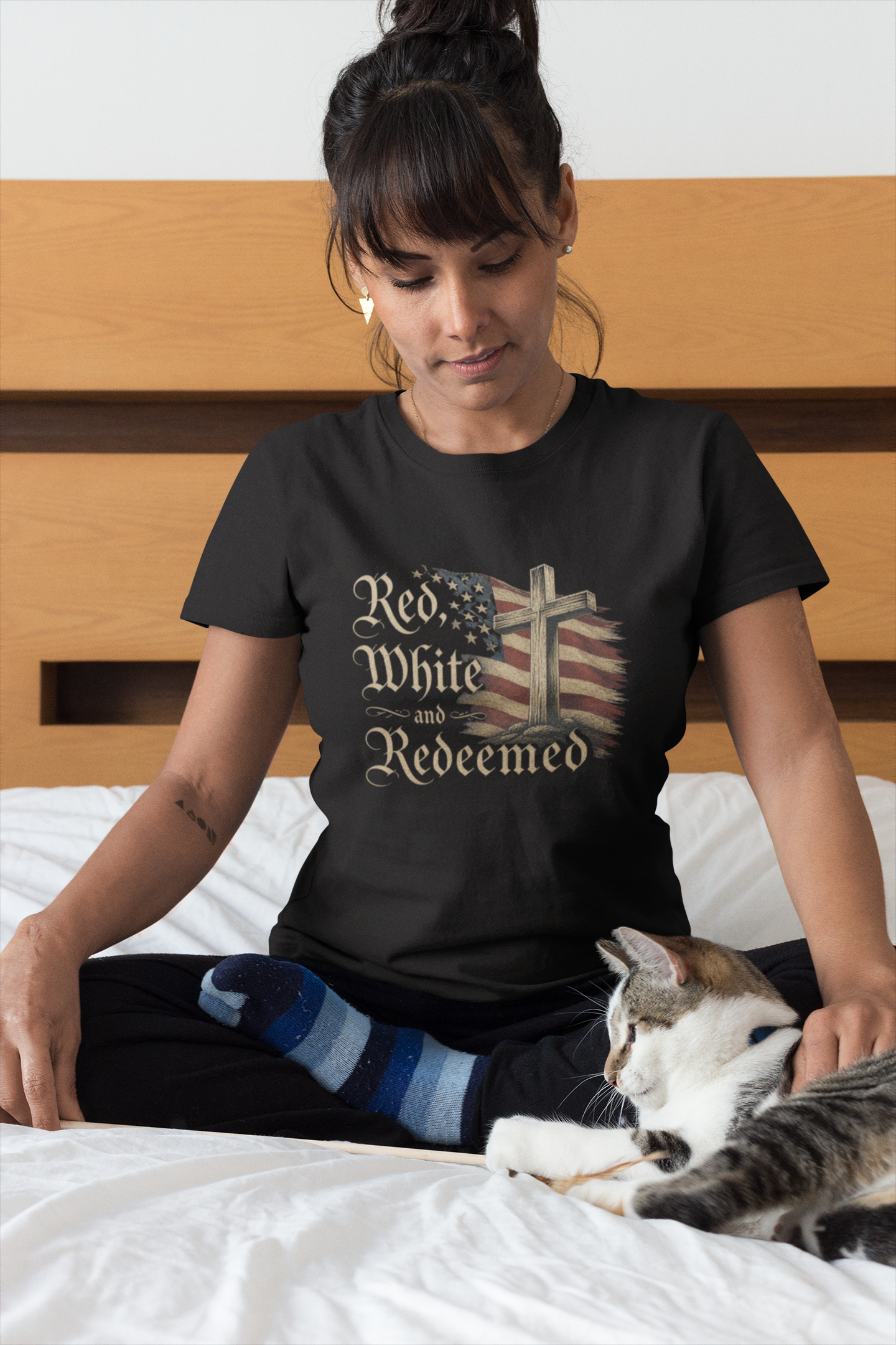 woman-wearing-a-t-shirt-mockup-petting-her-cat-on-bed-a18779.png