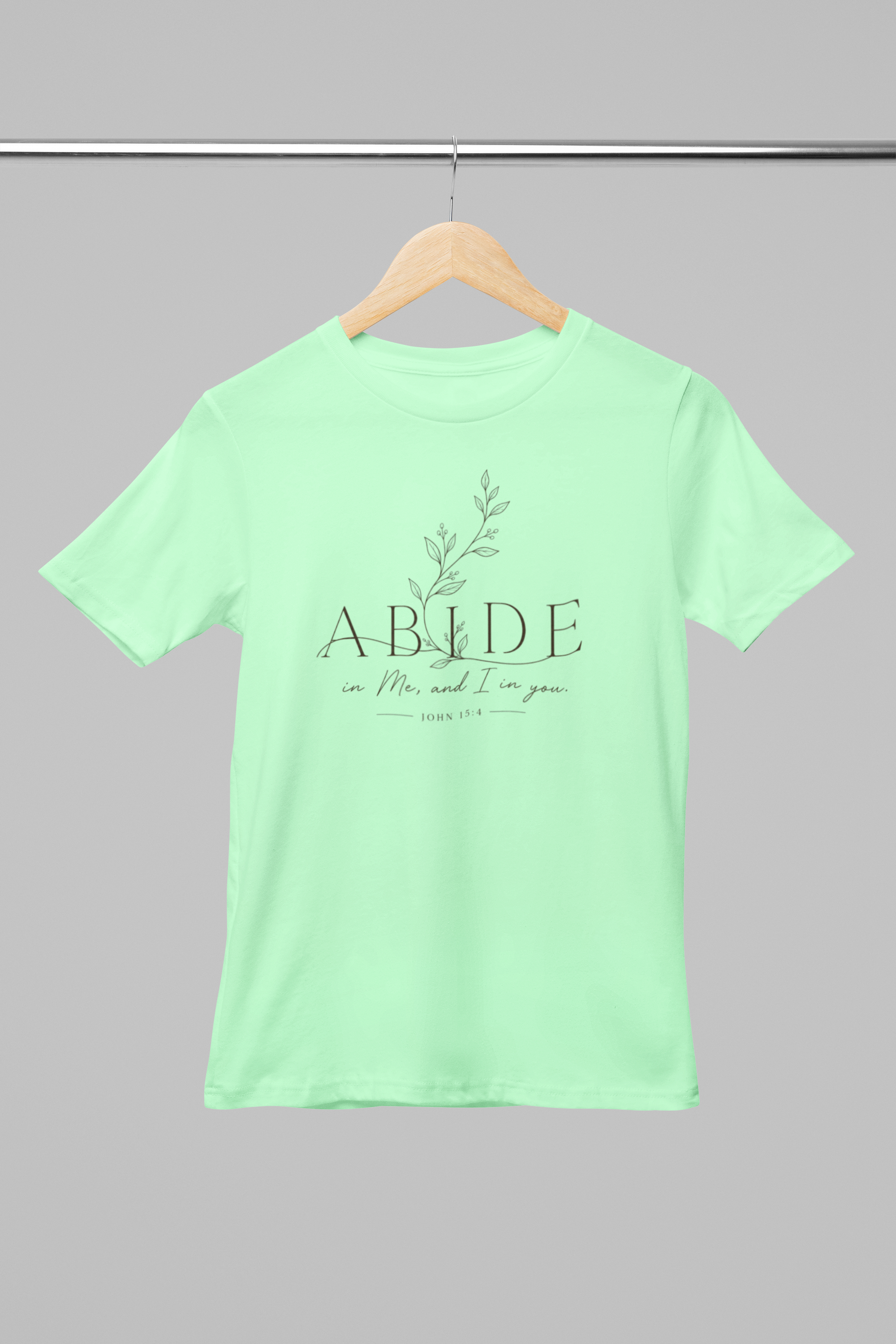 mockup-of-a-round-neck-bella-canvas-t-shirt-placed-on-a-hanger-m33392 (2).png