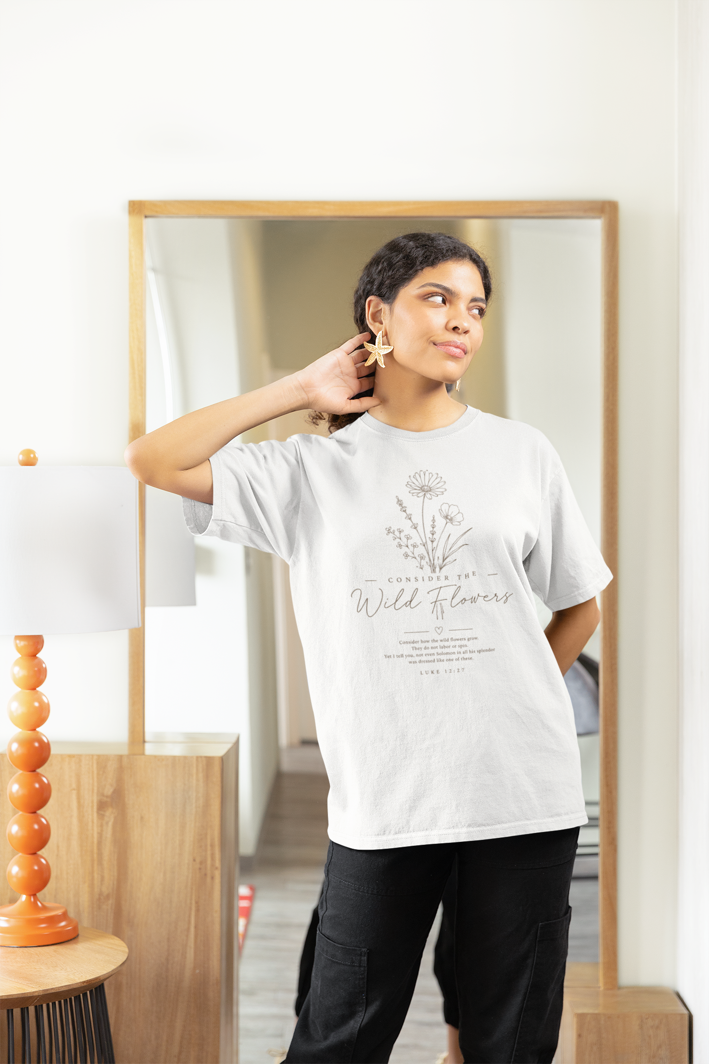 gildan-t-shirt-mockup-of-a-smiling-woman-posing-against-a-mirror-m32061.png