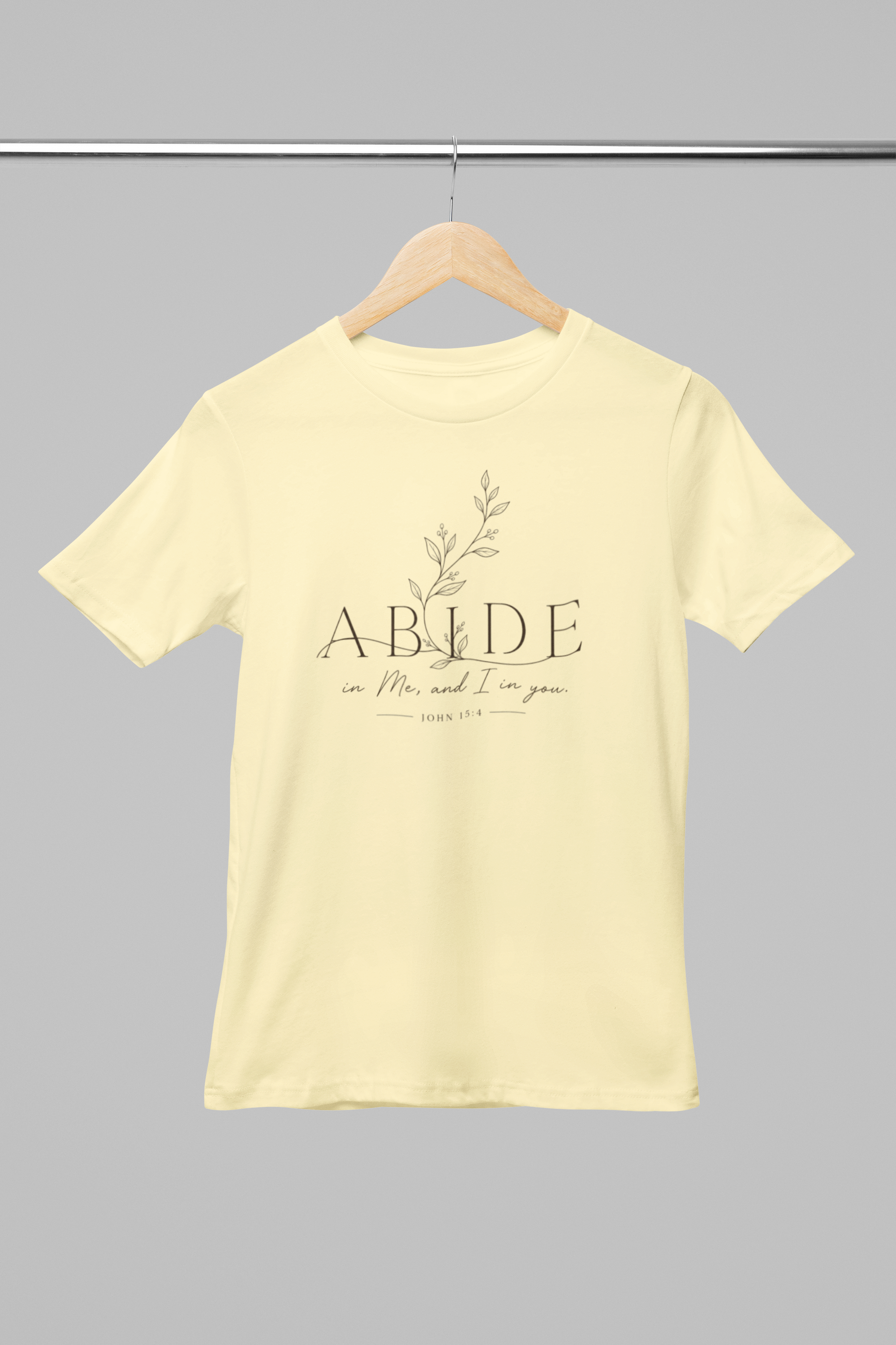 mockup-of-a-round-neck-bella-canvas-t-shirt-placed-on-a-hanger-m33392 (4).png