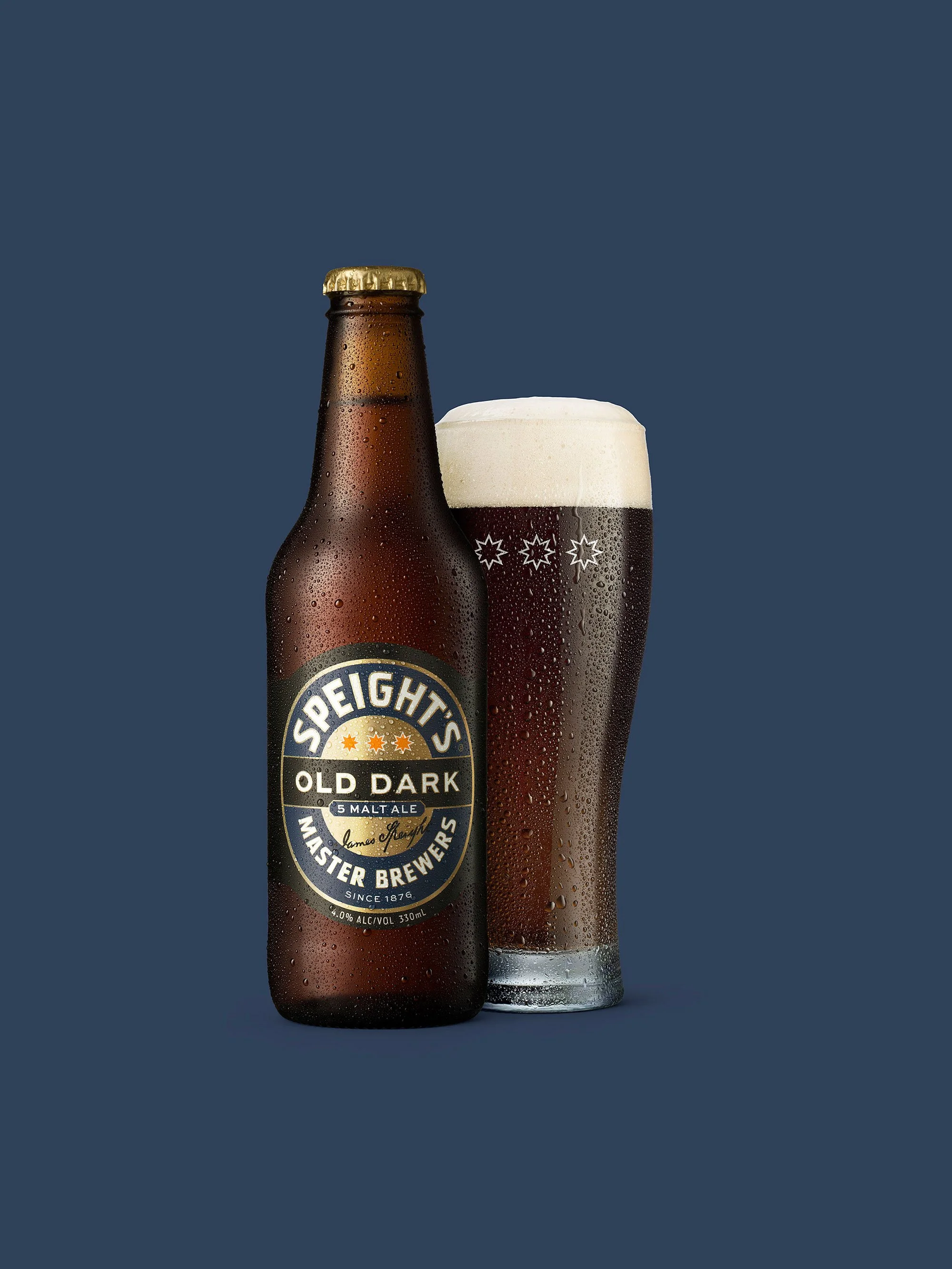 Studio product shot of Speight’s Old Dark with a poured glass, showing the richness of the beer and a clean commercial style.