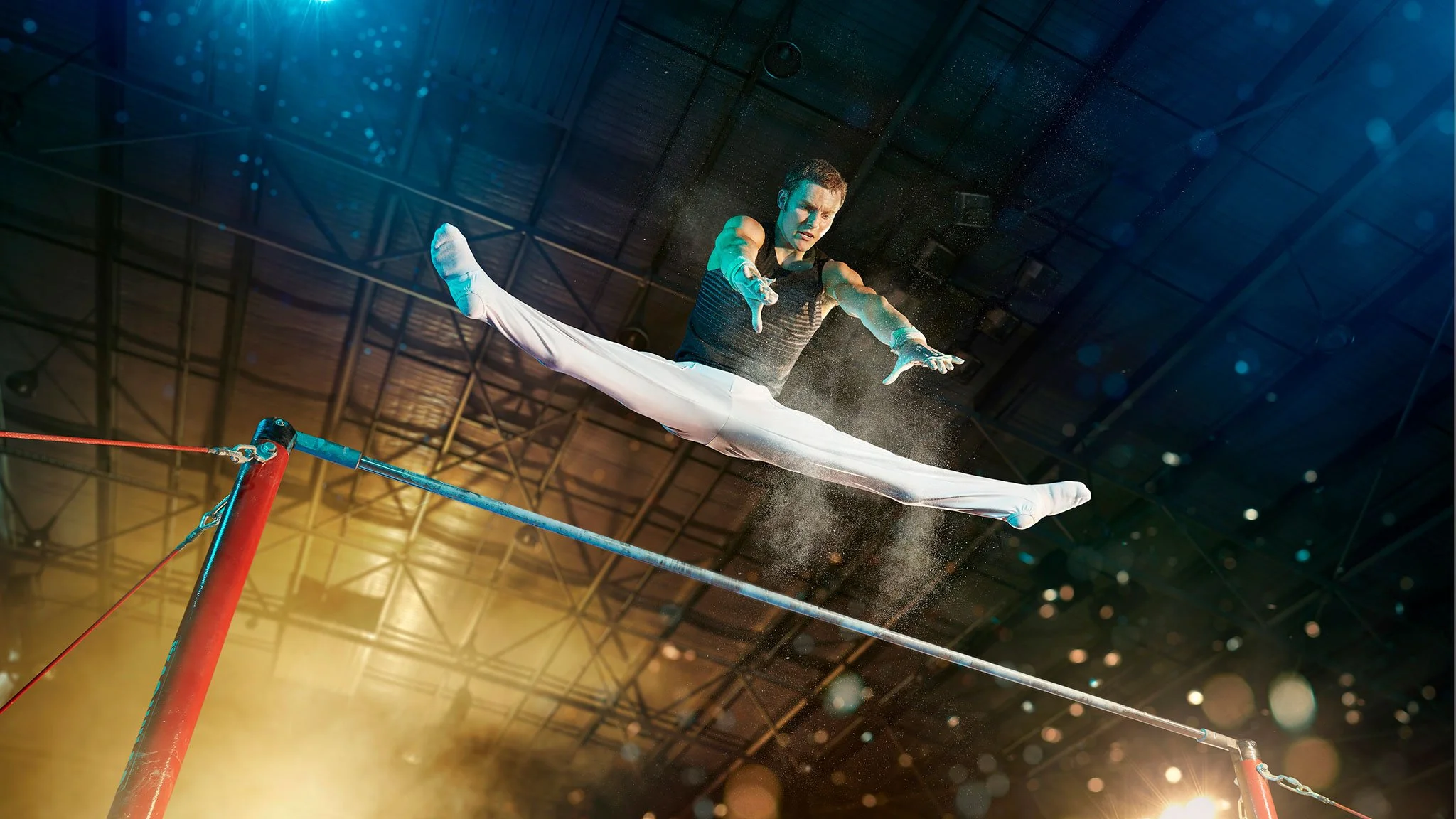 High-impact gymnastics photography capturing athletic control, power and precision in a cinematic commercial sports setting.