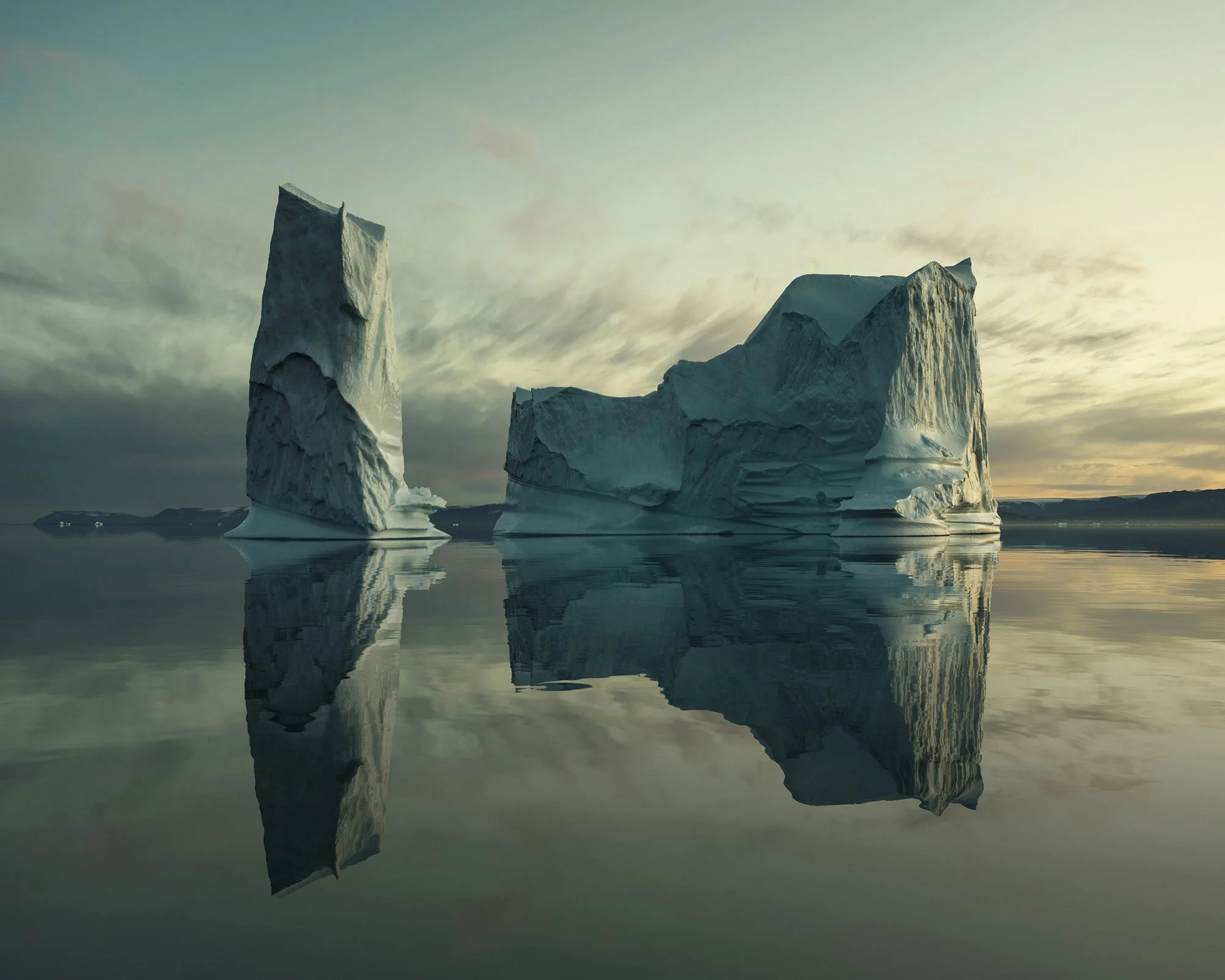Minimal iceberg landscape photograph emphasizing shape, symmetry and stillness in a serene polar environment.