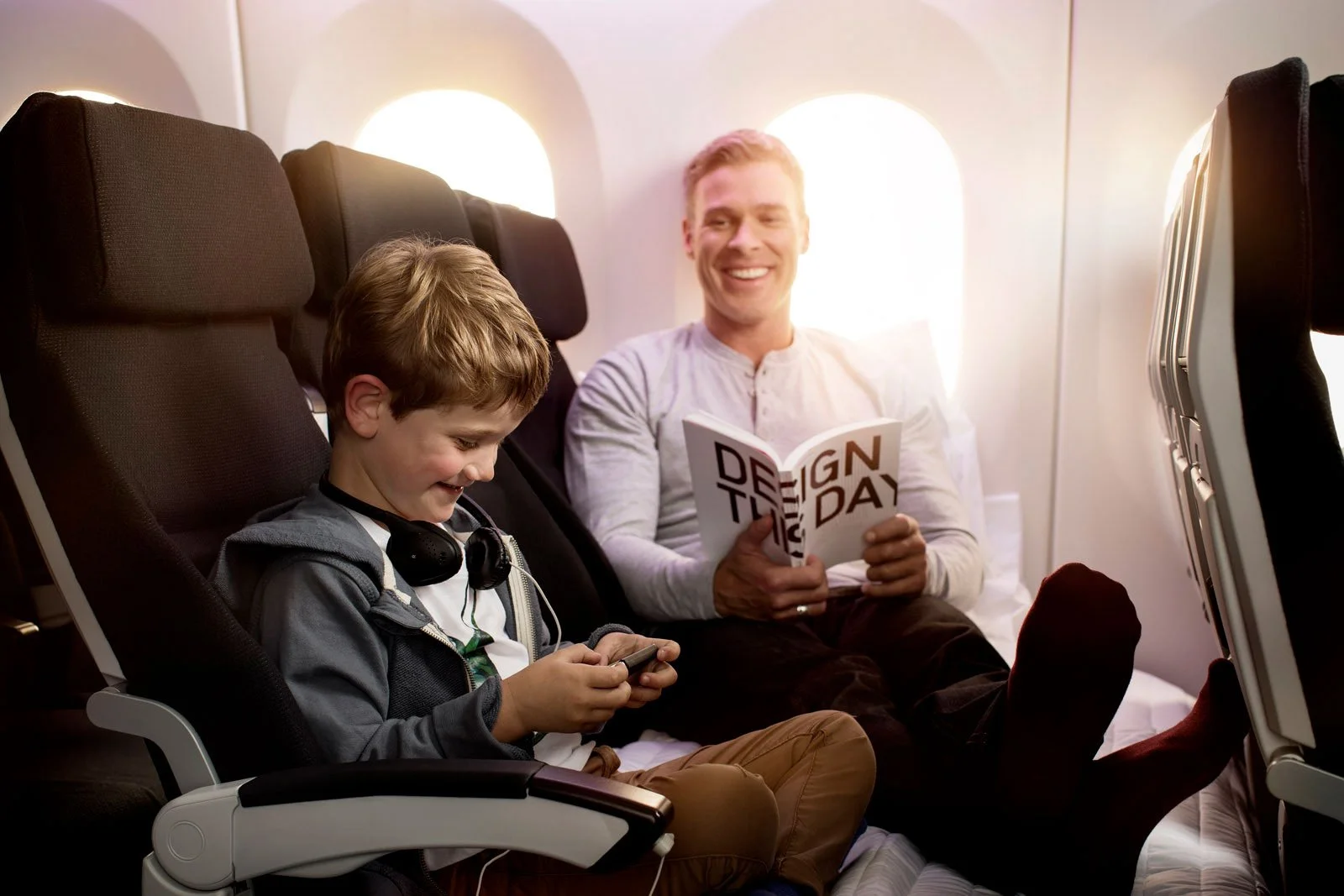 Travel lifestyle photography capturing a relaxed family moment on board an aircraft, created for tourism, airline and destination campaign storytelling.