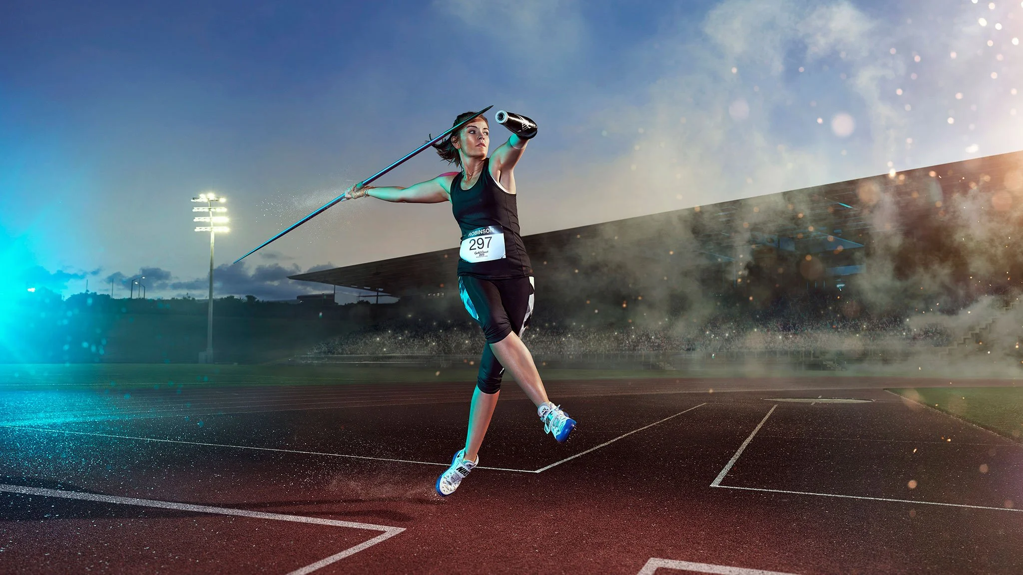 Track and field campaign photography showing a javelin athlete in motion, with stadium lights, atmosphere and cinematic energy.