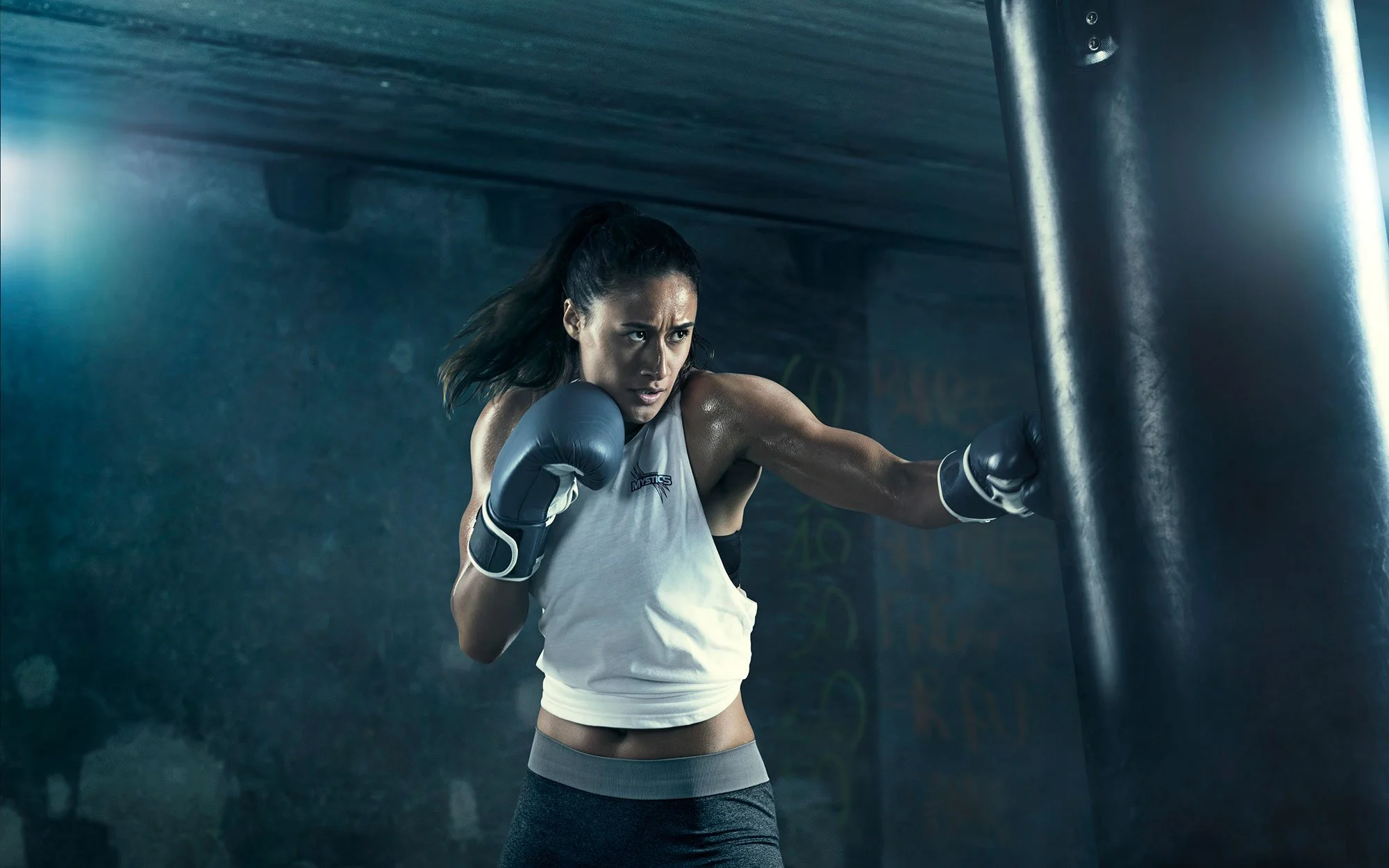Commercial boxing photography capturing speed, power and intensity with cinematic lighting and a strong advertising feel.