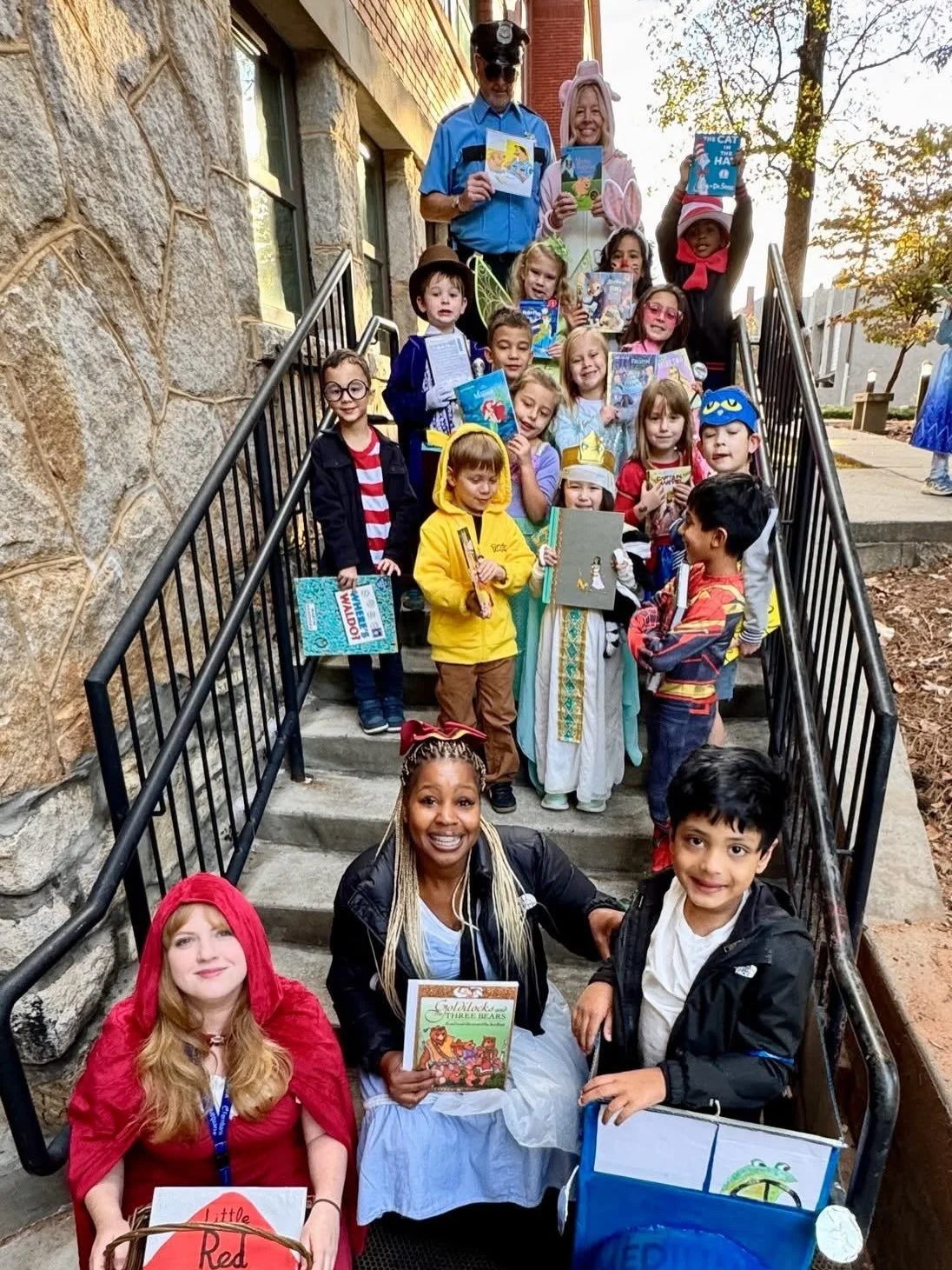 From fairytales to heroes bold,
A thousand stories to be told!
With costumes bright and smiles wide,
Our favorite characters came to life outside!

Animals, superheroes, witches, too,
A world of wonder came marching through!
Each little reader, a sto