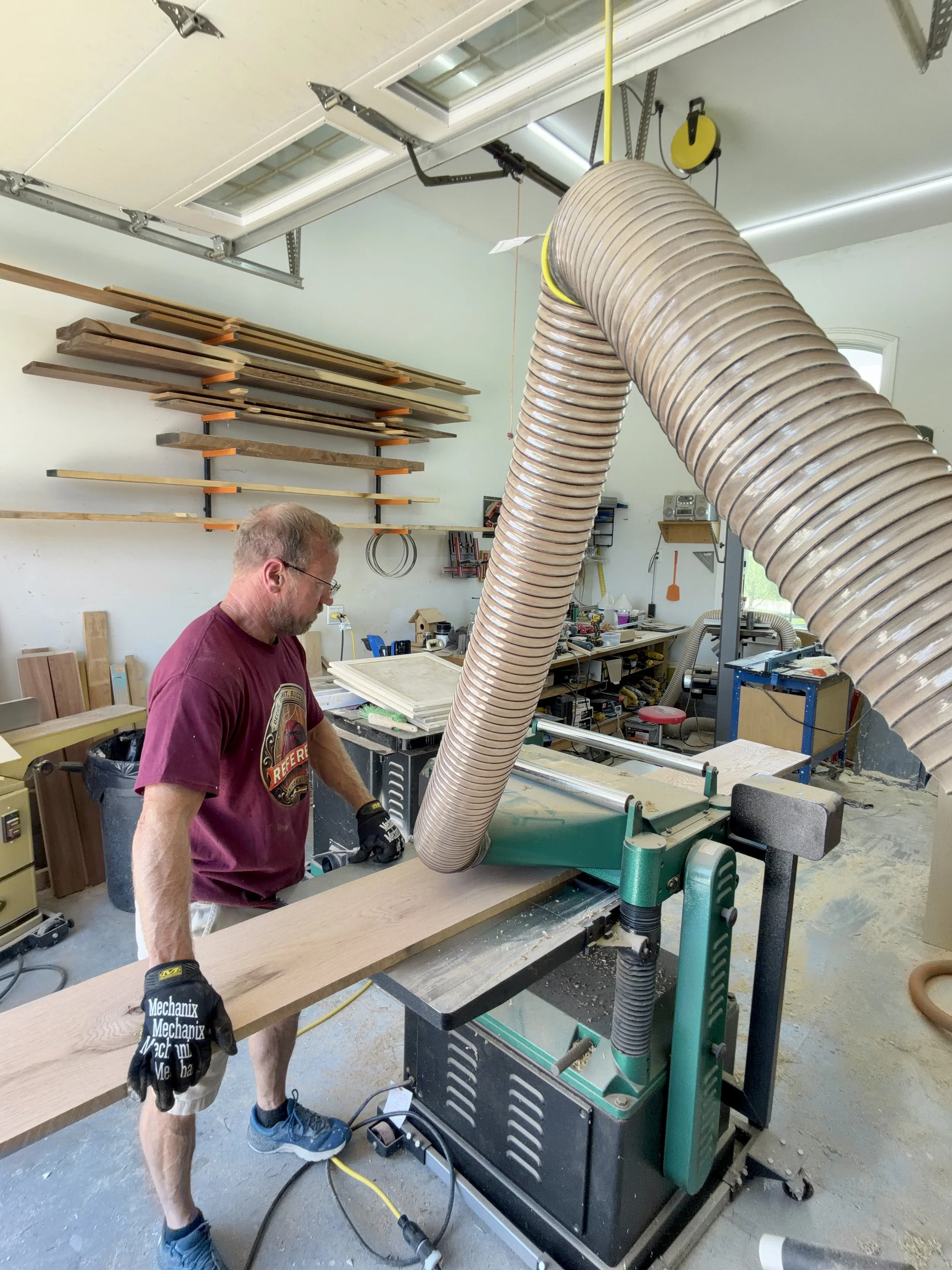 Handcrafted mahjong table being built by Tom in The Mahj Table Co workshop with woodworking tools and custom furniture craftsmanship