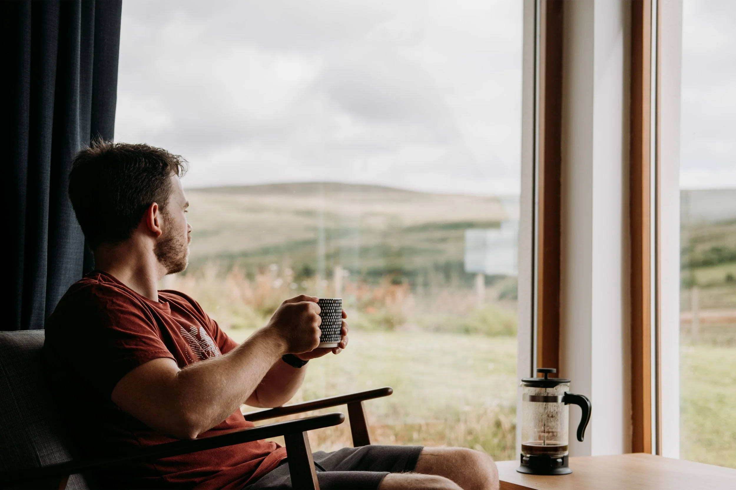 Relaxed man looking out of window