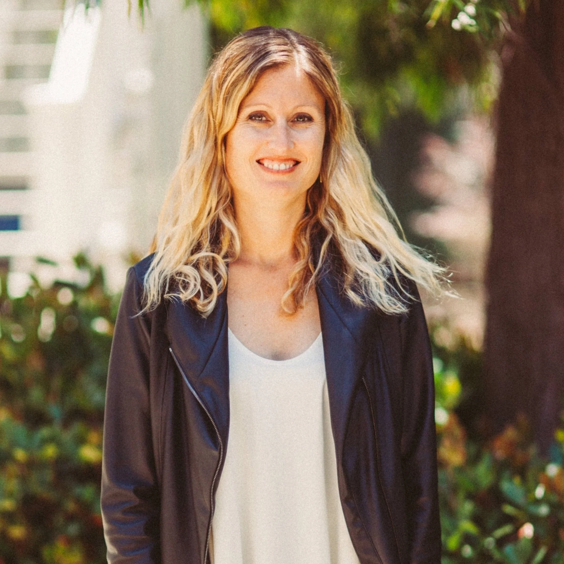 Emily Slater, Children's Ministry Director, smiling outdoors in a black jacket
