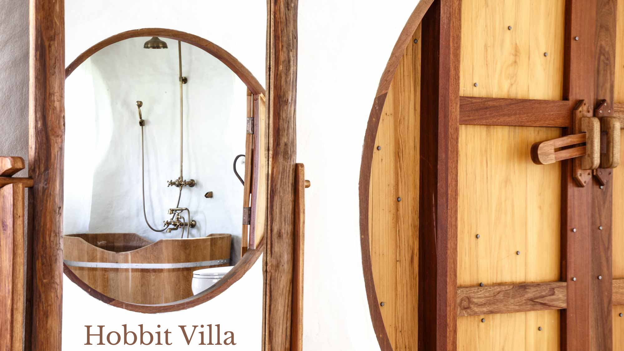 A rustic wooden door with a latch, partly open, revealing a bathroom with a vintage-style brass tap, a mirror, and a white toilet with a wooden basin.