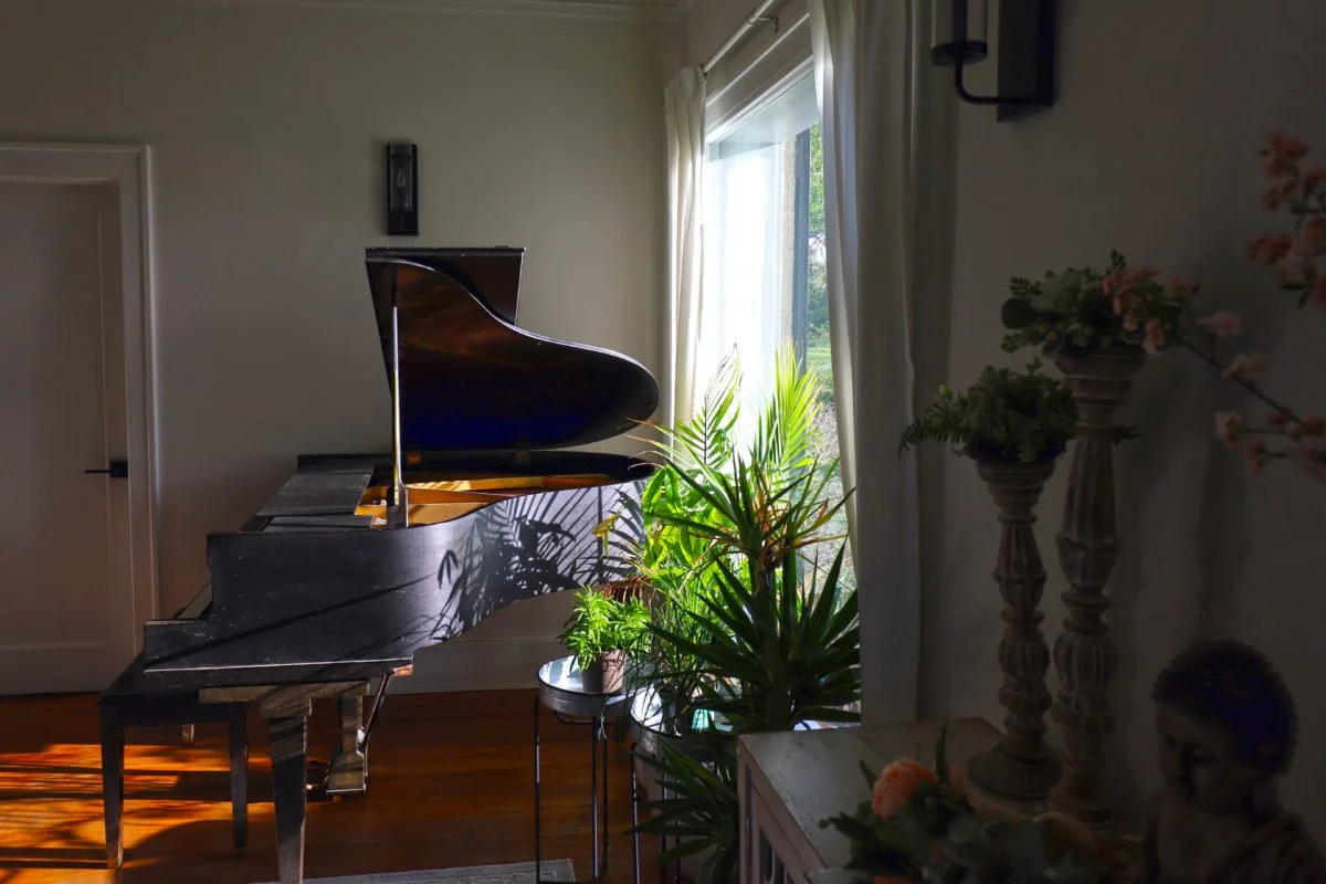 Baby grand piano in living room