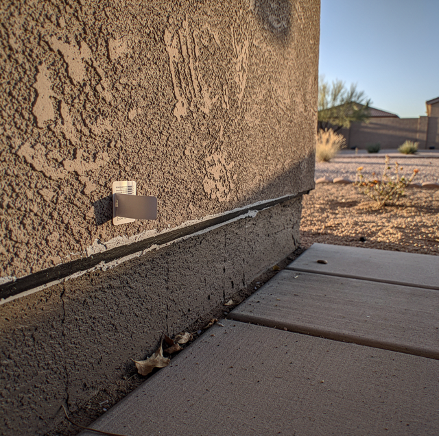 scorpion sealing warranty paperwork on checklist with stucco crack