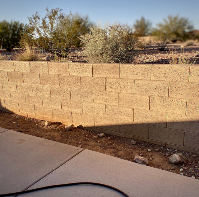 desert subdivision block wall at lot line dusk