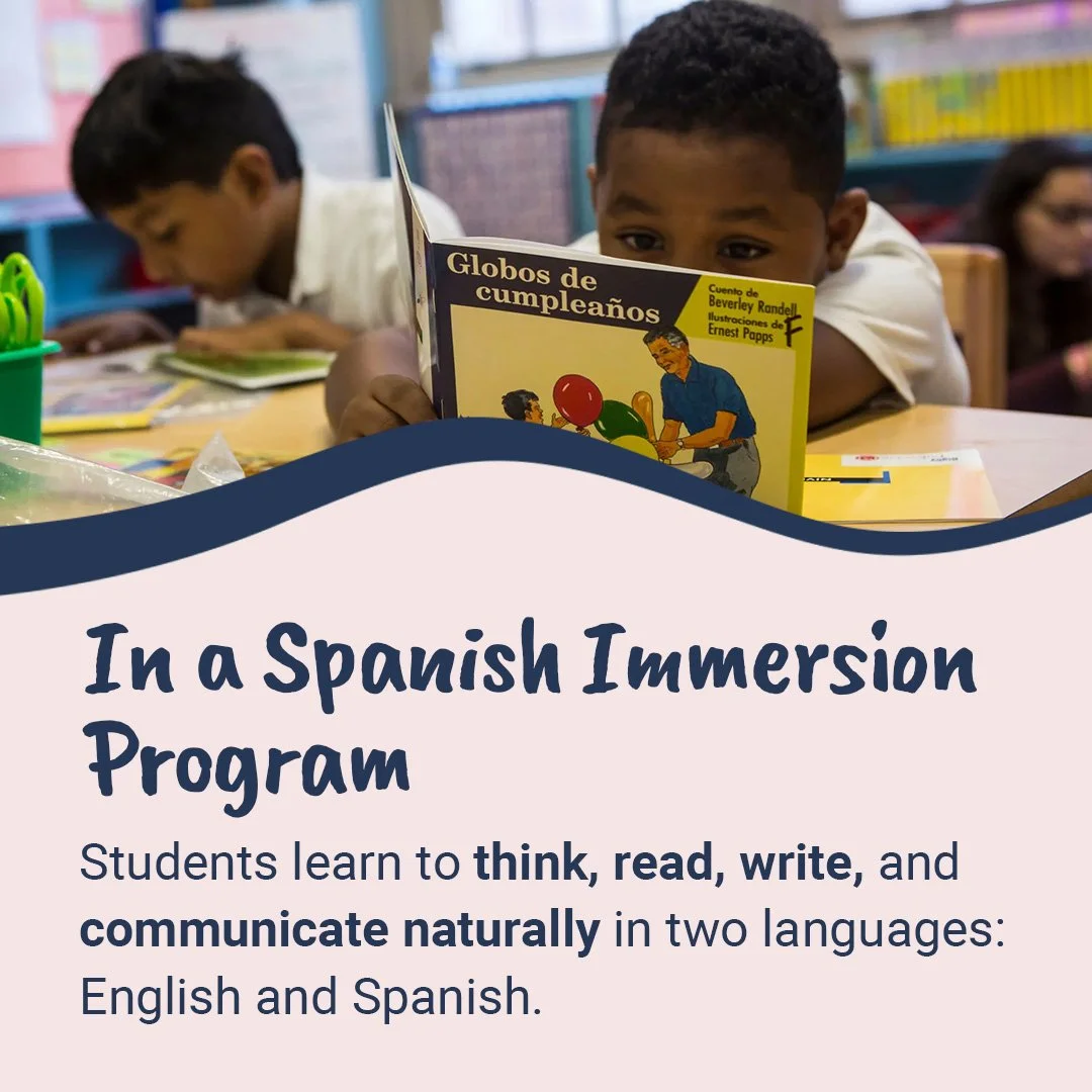 Children studying at a classroom desk with a colorful bookshelf in the background. One child in the foreground is reading a Spanish book titled 'Globos de cumpleaños'.