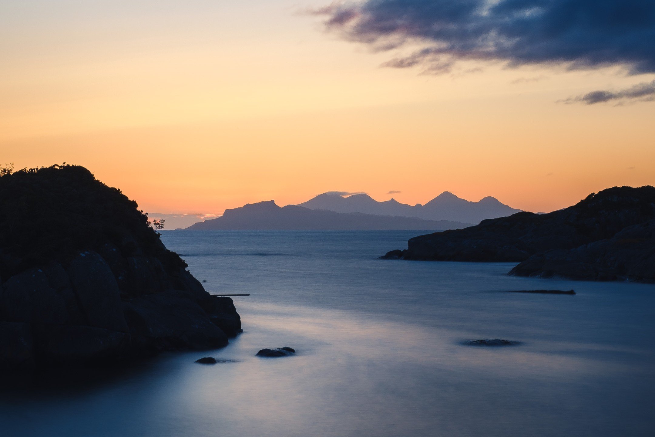 The silhouette of the Isle of Eigg viewed from Ardtoe during the blue hour | Ardnamurchan Scotland | Steven Marshall Photography