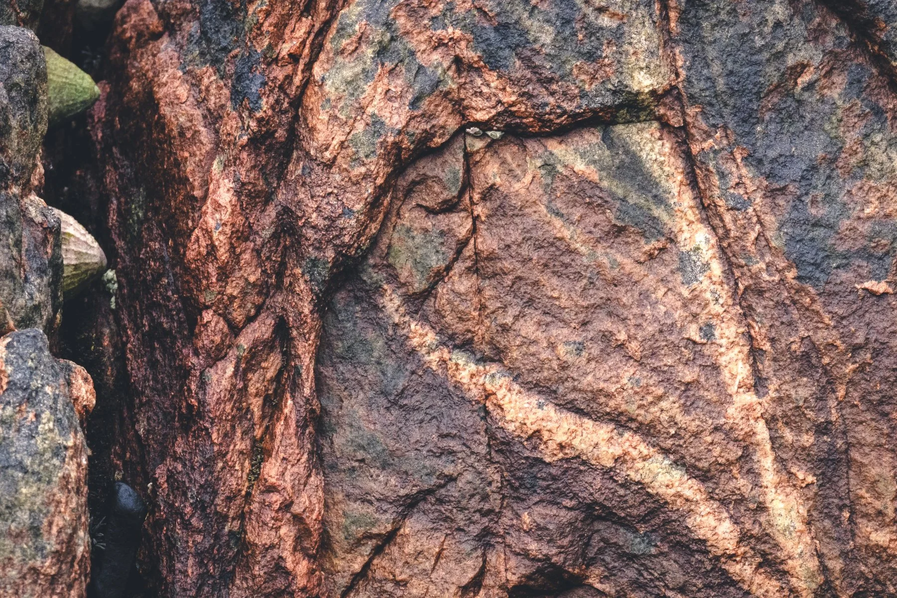 Rocks with lines and colours in them on the shore of Loch Sunart at Resipole | Sunart Scotland | Steven Marshall Photography