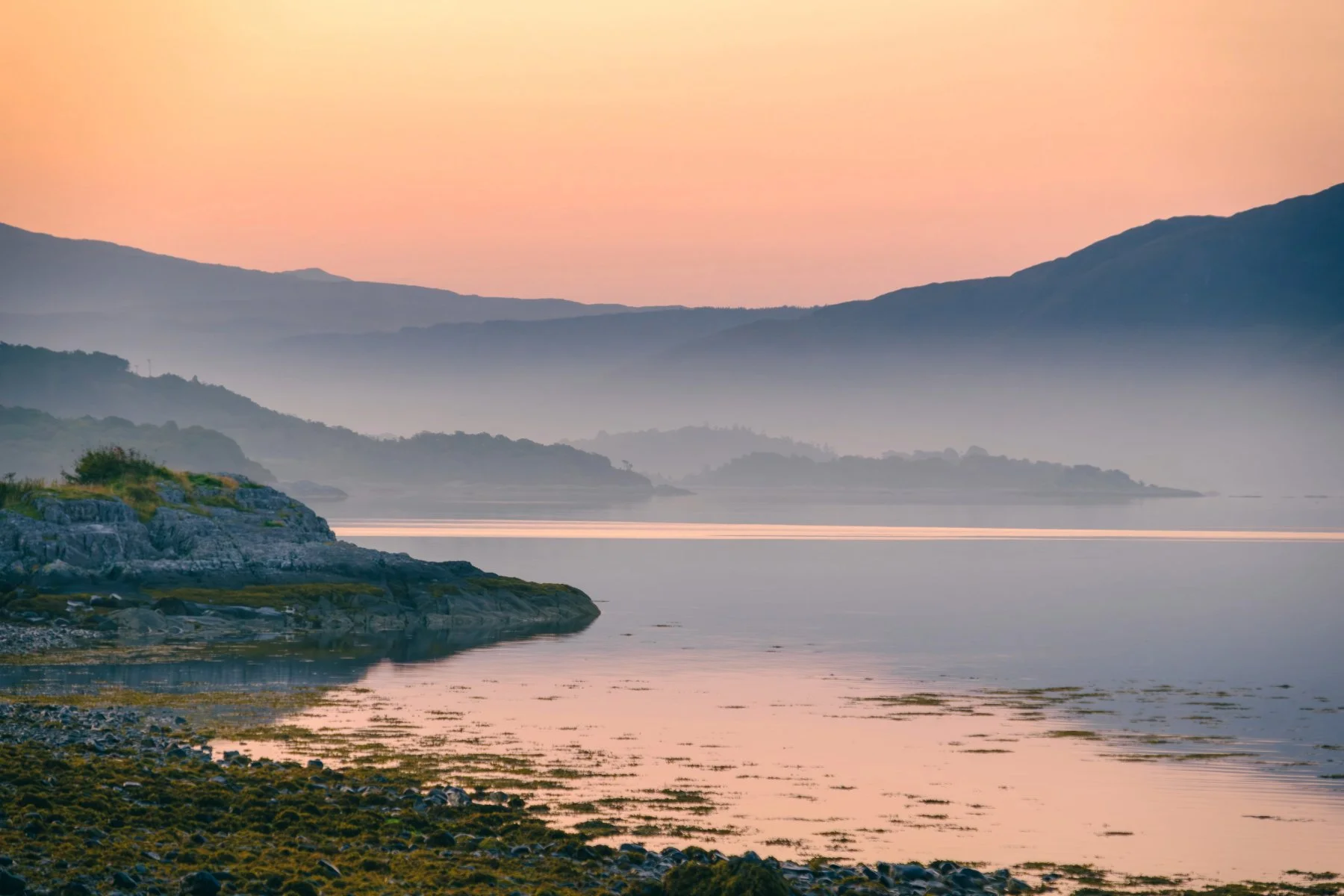 A golden pink sunrise over Loch Sunart at Resipole on a misty morning | Sunart Scotland | Steven Marshall Photography