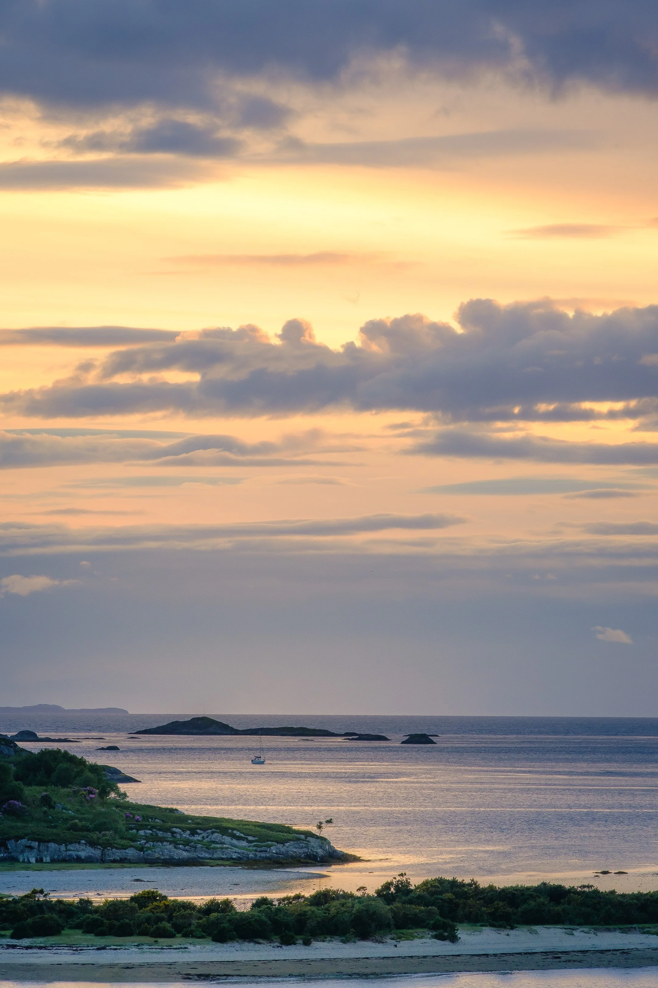 A sailboat moored safely in the South Channel of Loch Moidart at sunset | Moidart Scotland | Steven Marshall Photography