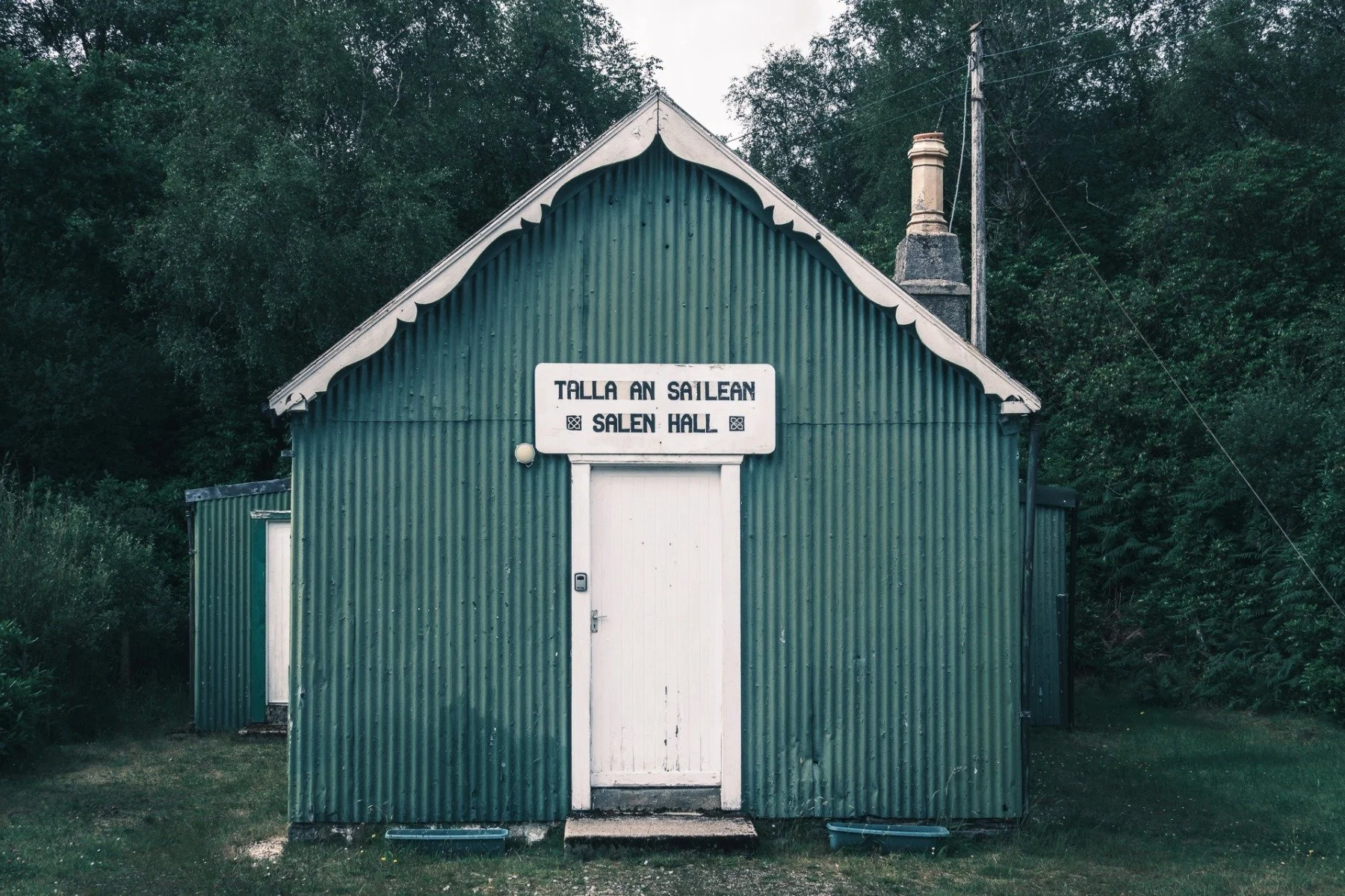A green painted, corrugated tin/iron building used as a village hall | Salen Ardnamurchan Scotland | Steven Marshall Photography