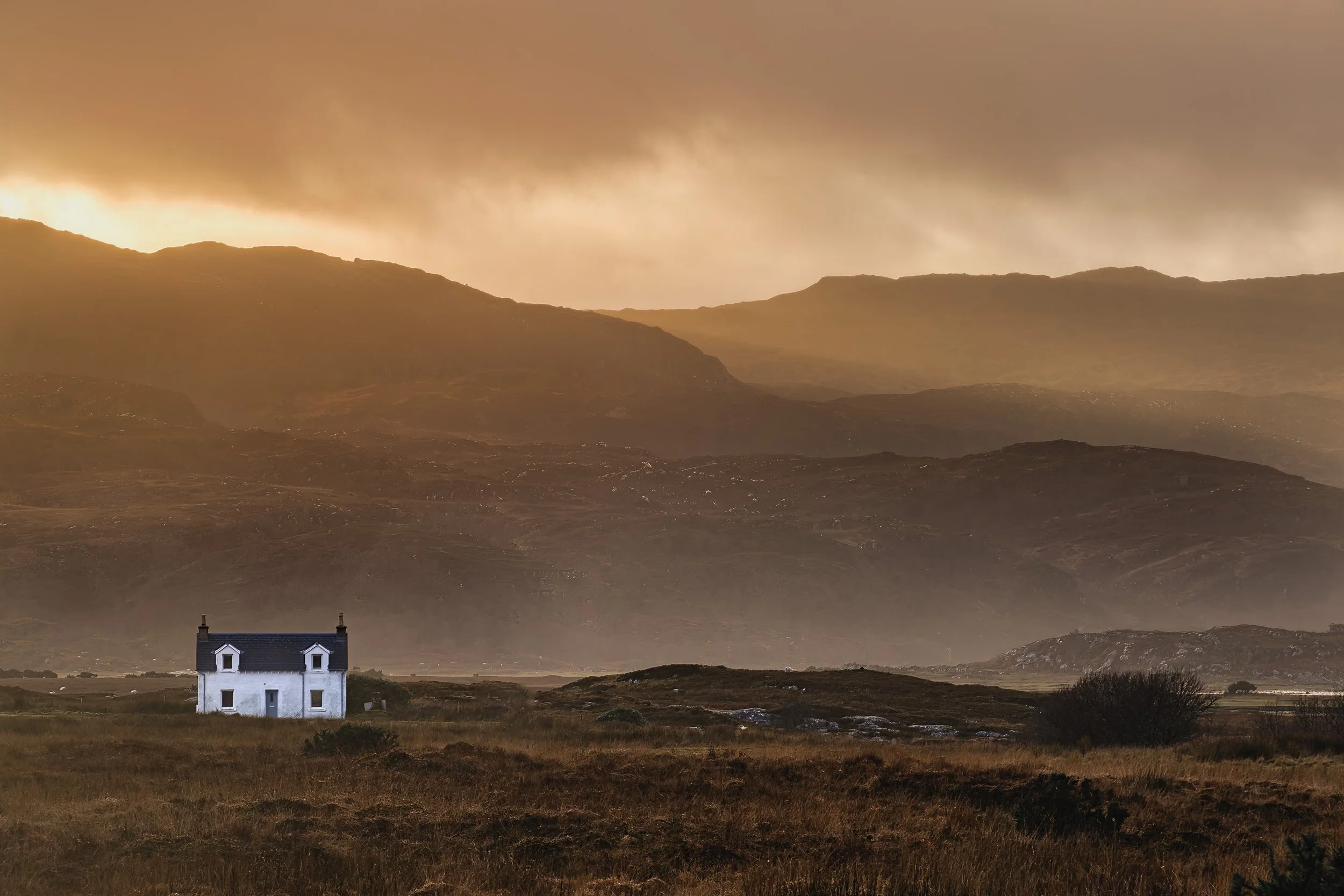 A highland croft house under a stormy sky at Kentra Bay | Ardnamurchan Scotland | Steven Marshall Photography