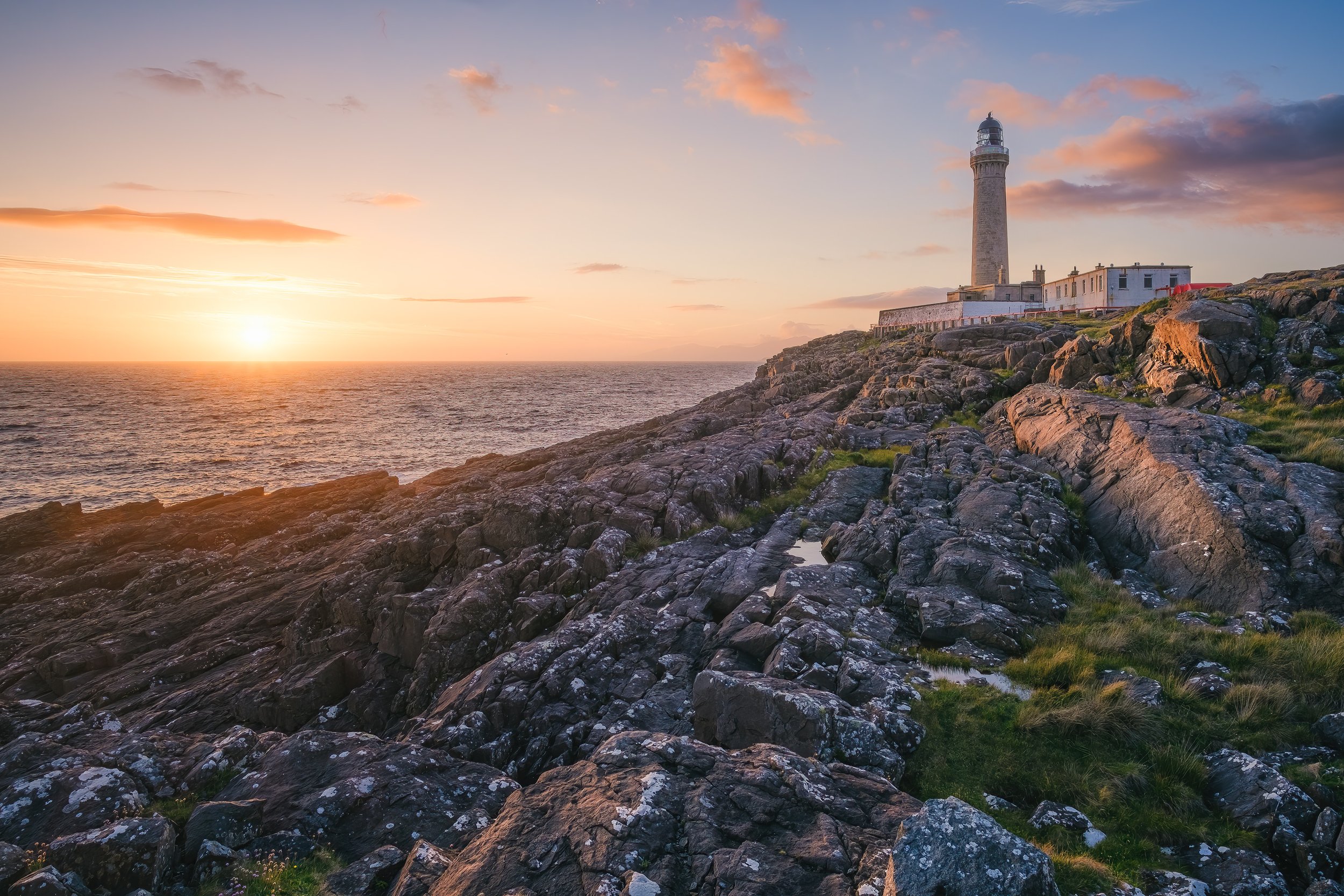 The sun setting beyond Ardnamurchan Lighthouse on a midsummer day | Ardnamurchan Scotland | Steven Marshall Photography
