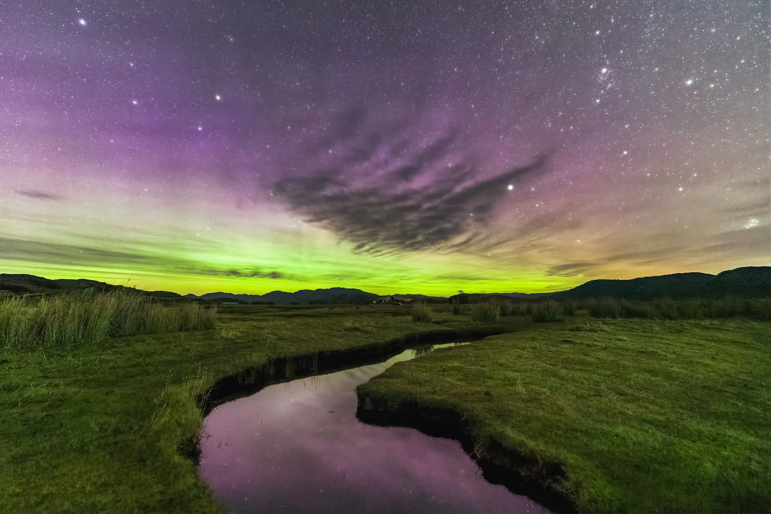 A bright Aurora, Northern Lights, above the salt marsh at the edge of Kentra Bay, Ardnamurchan, Scotland | Steven Marshall Photography