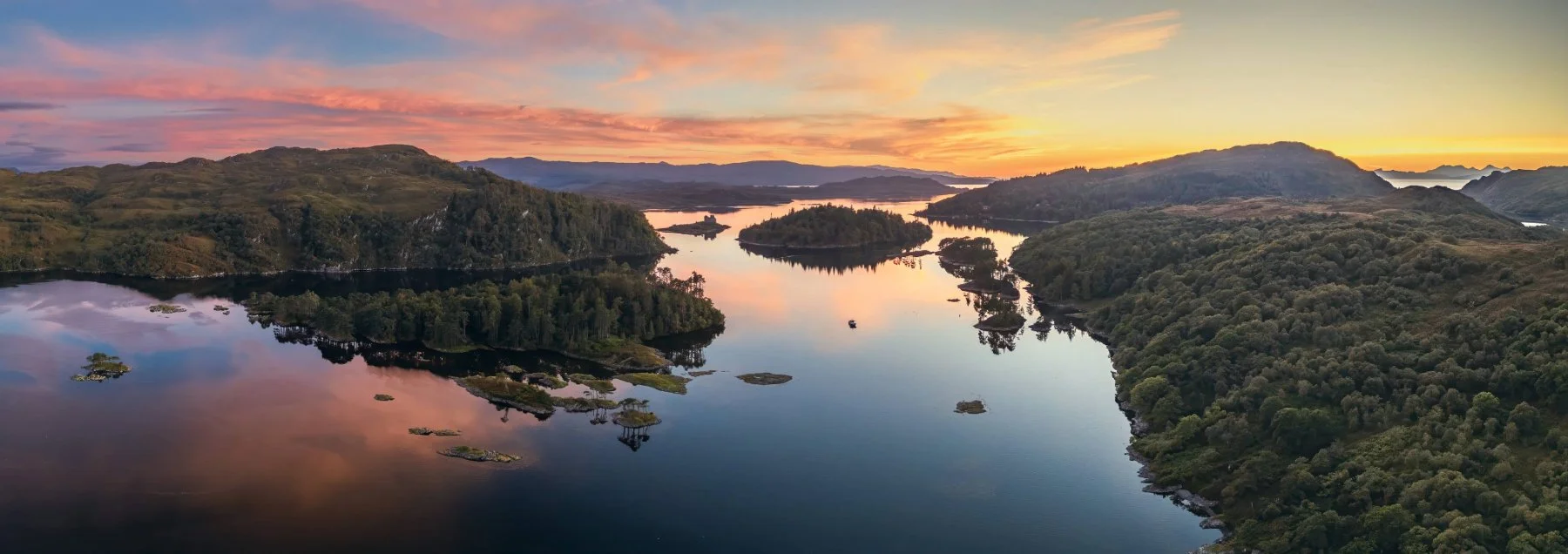 An ariel view of Loch Moidart looking over Eilean an Fheidh towards Castle Tioram and Riska Island at sunset | Moidart Scotland | Steven Marshall Photography