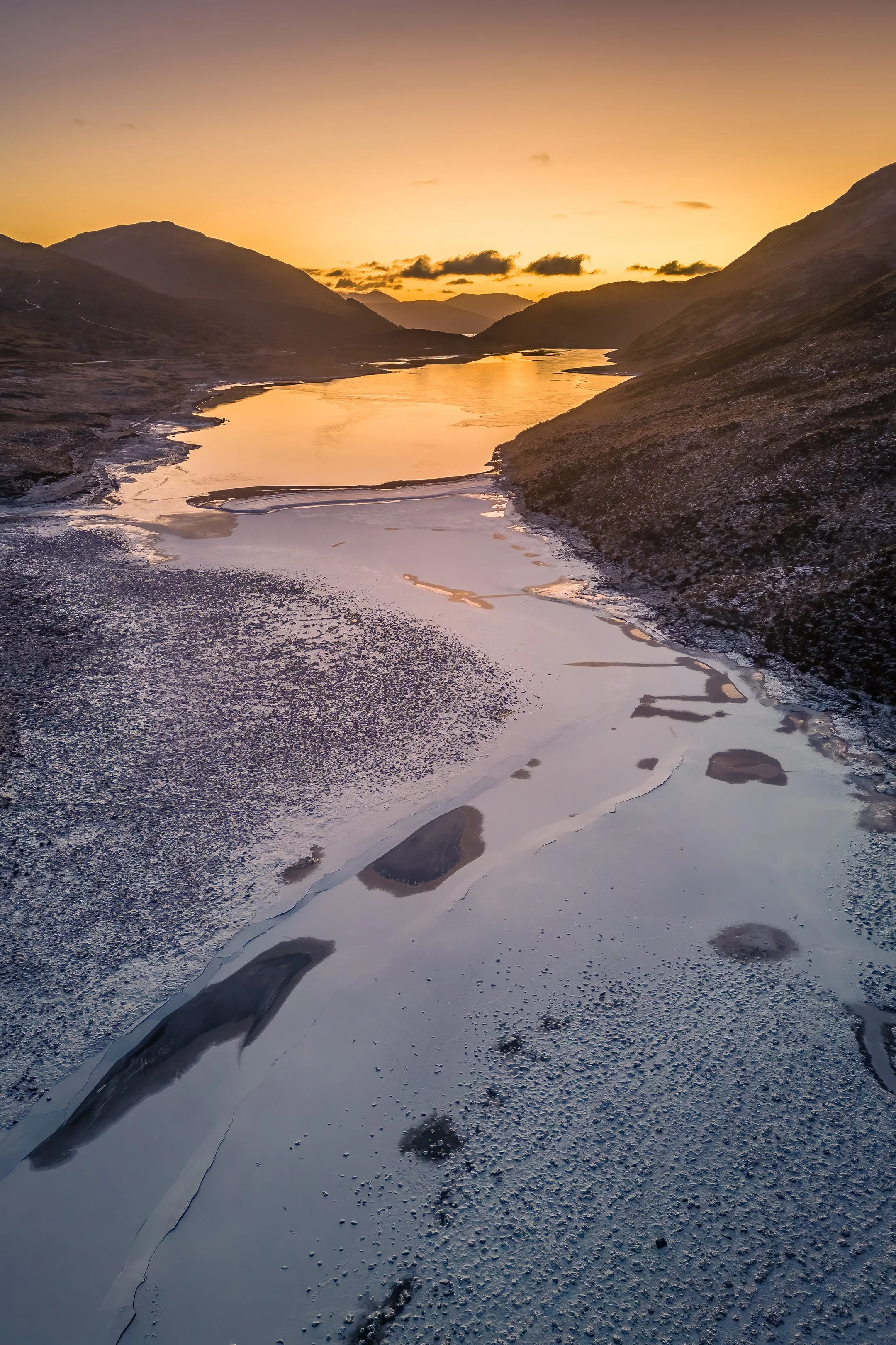 A frozen Loch Uisge at Kingairloch on a winter morning with snow on its surface | Ardgour Scotland | Steven Marshall Photography