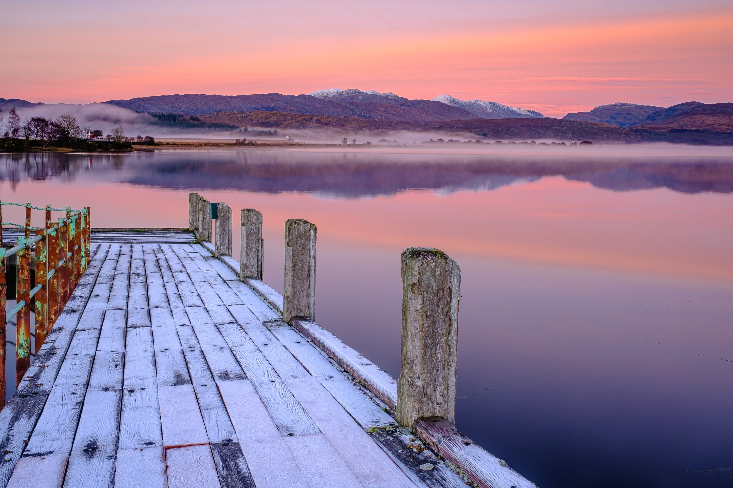 Frost covered jetty at Acharacle leading out into mirror-like Loch Shiel at sunset | Ardnamurchan Scotland | Steven Marshall Photography