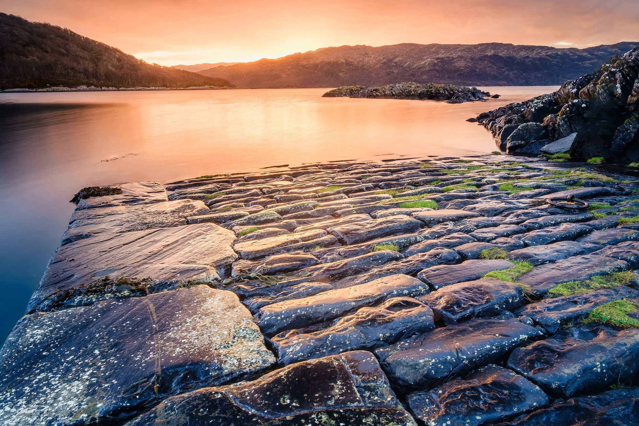 The Salen Jetty at sunrise on a calm January morning with a red and yellow colours on Loch Sunart | Ardnamurchan Scotland | Steven Marshall Photography