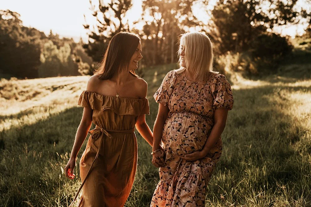 Woman reflecting during pregnancy, representing emotional support across fertility and early motherhood
