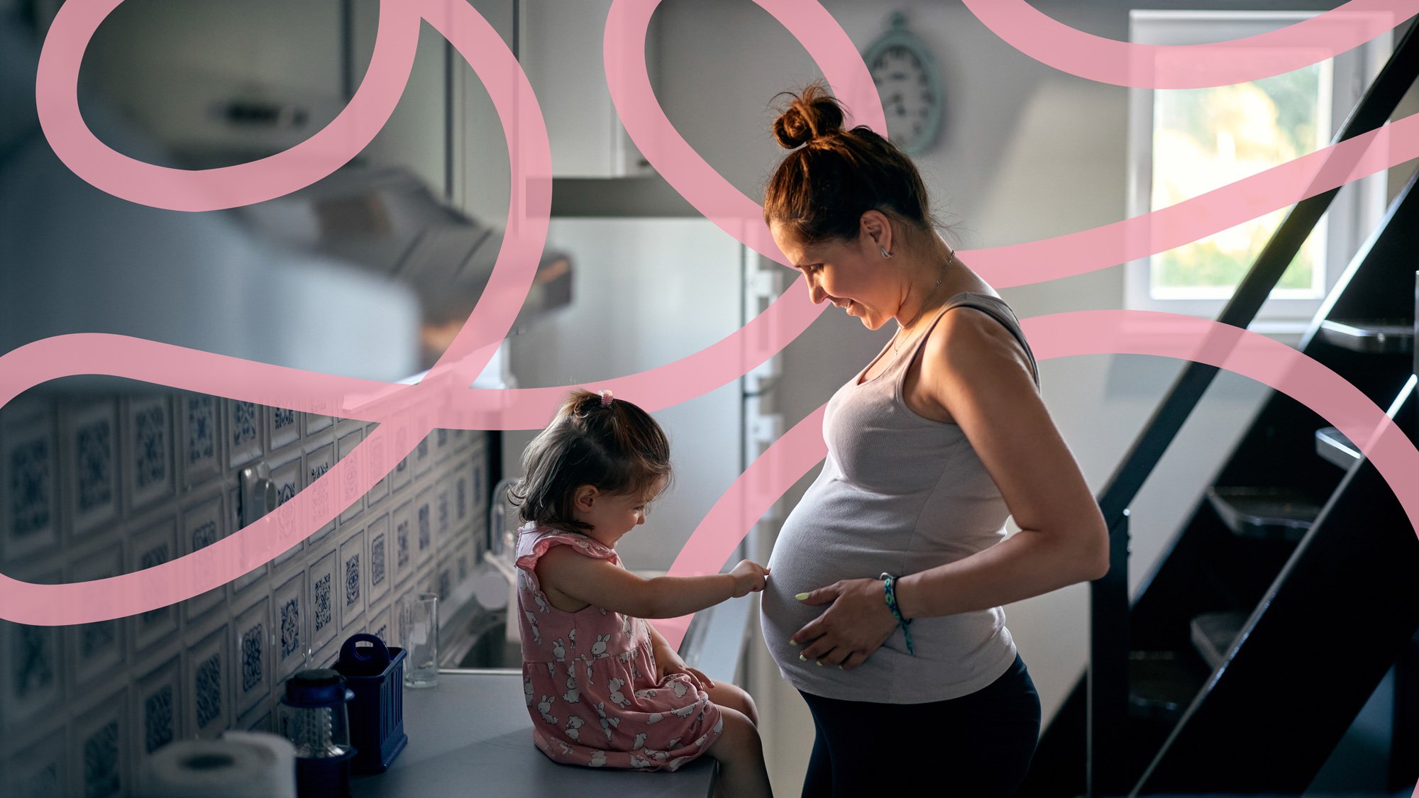 oung toddler touching her pregnant mother's belly, representing family emotional support and perinatal psychology care