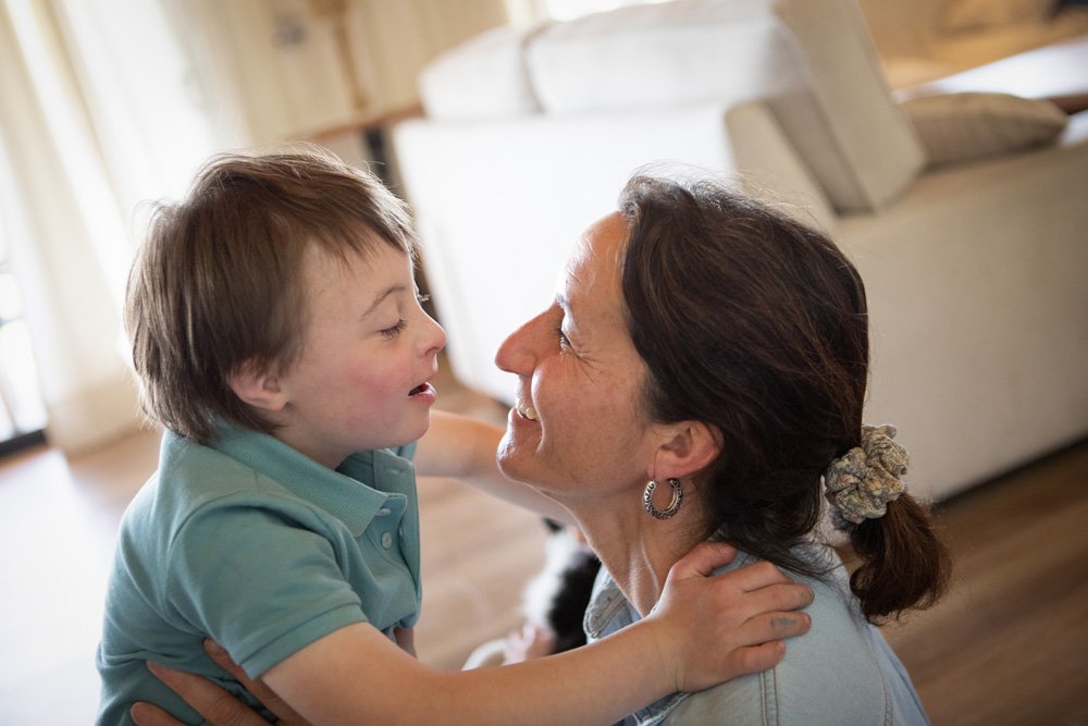 Child playing in a bright room, representing family-centered perinatal mental health care for women across ages, identities, ethnicities and cultures