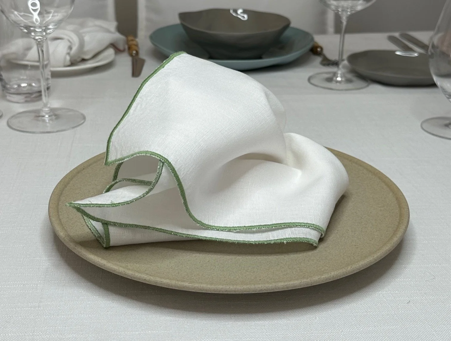 white-linen-with-sage-edge-napkin-01.jpg