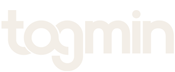A white logo with the word 'tomn' in lowercase letters