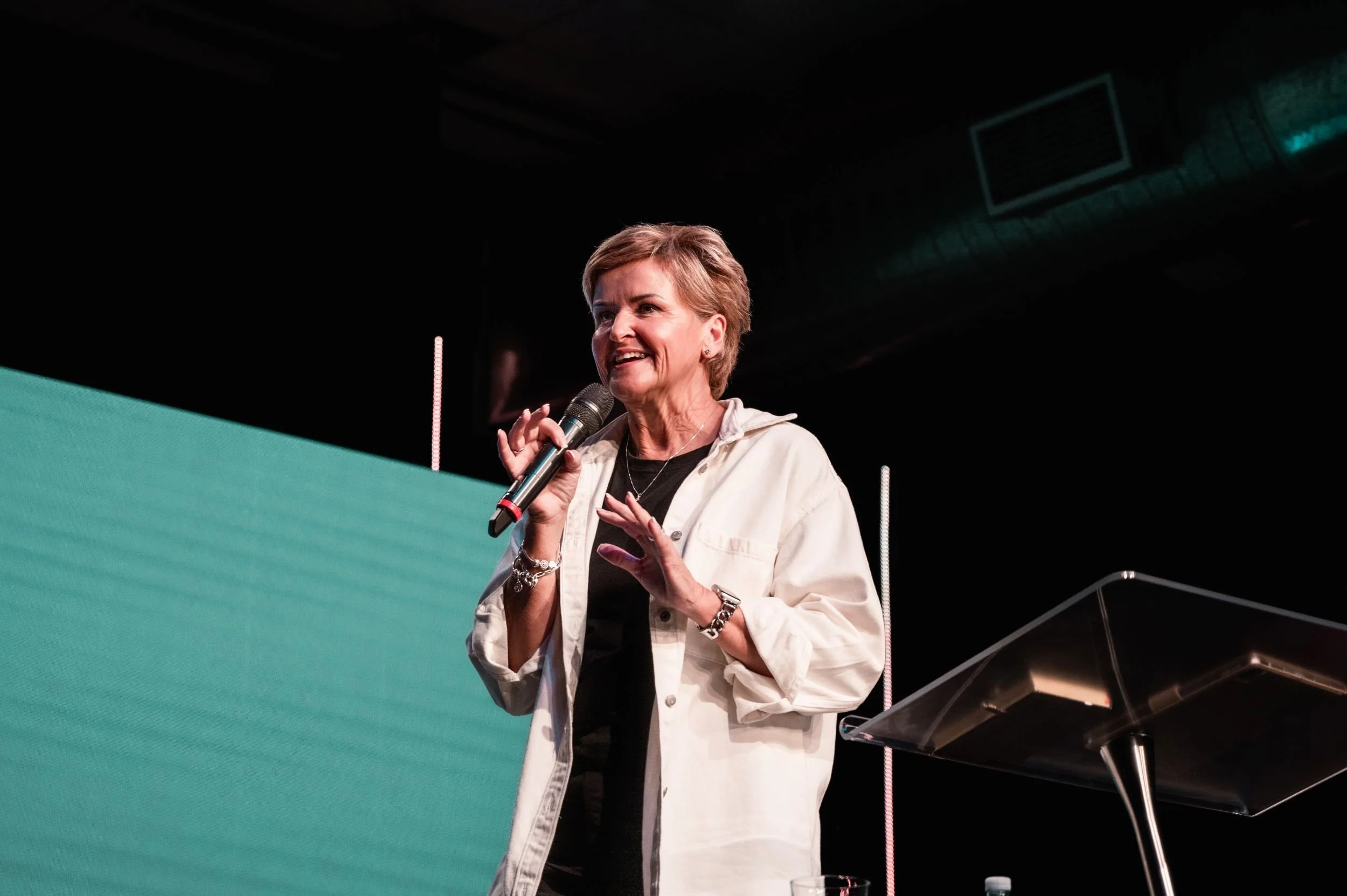 Jenny Gilpin preaching at an Esther's Table leadership event